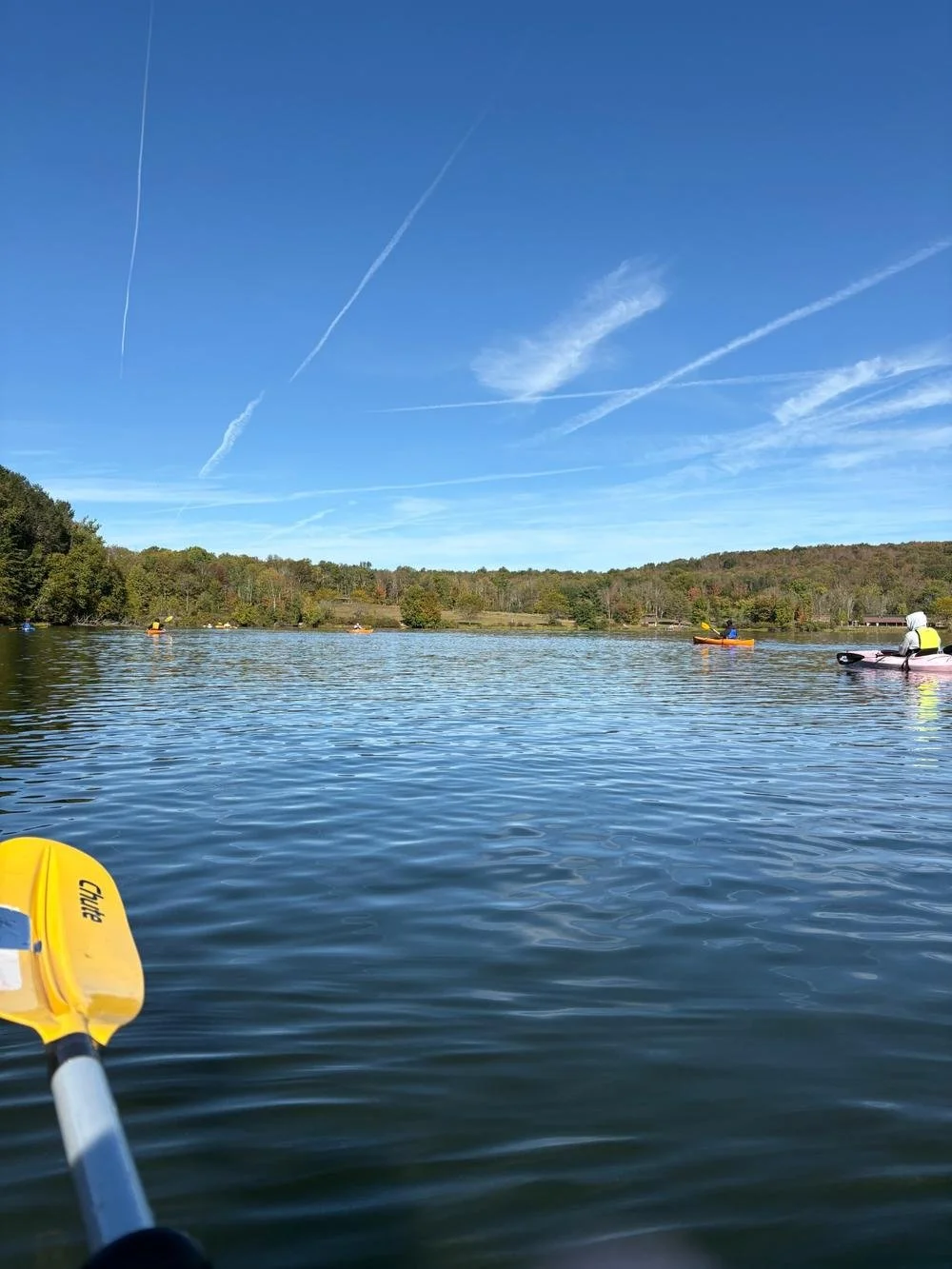 Alt text: Woodhaven residents kayaking on a lake during an outdoor recreation outing.