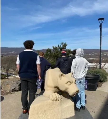 Teen boys looking out over a college campus setting, representing strategic planning, future goals, and life beyond treatment at Woodhaven Recovery.