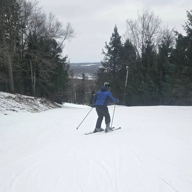 Woodhaven Recovery resident skiing during a winter recreation outing, reflecting sober fun, outdoor activity, and seasonal adventure.