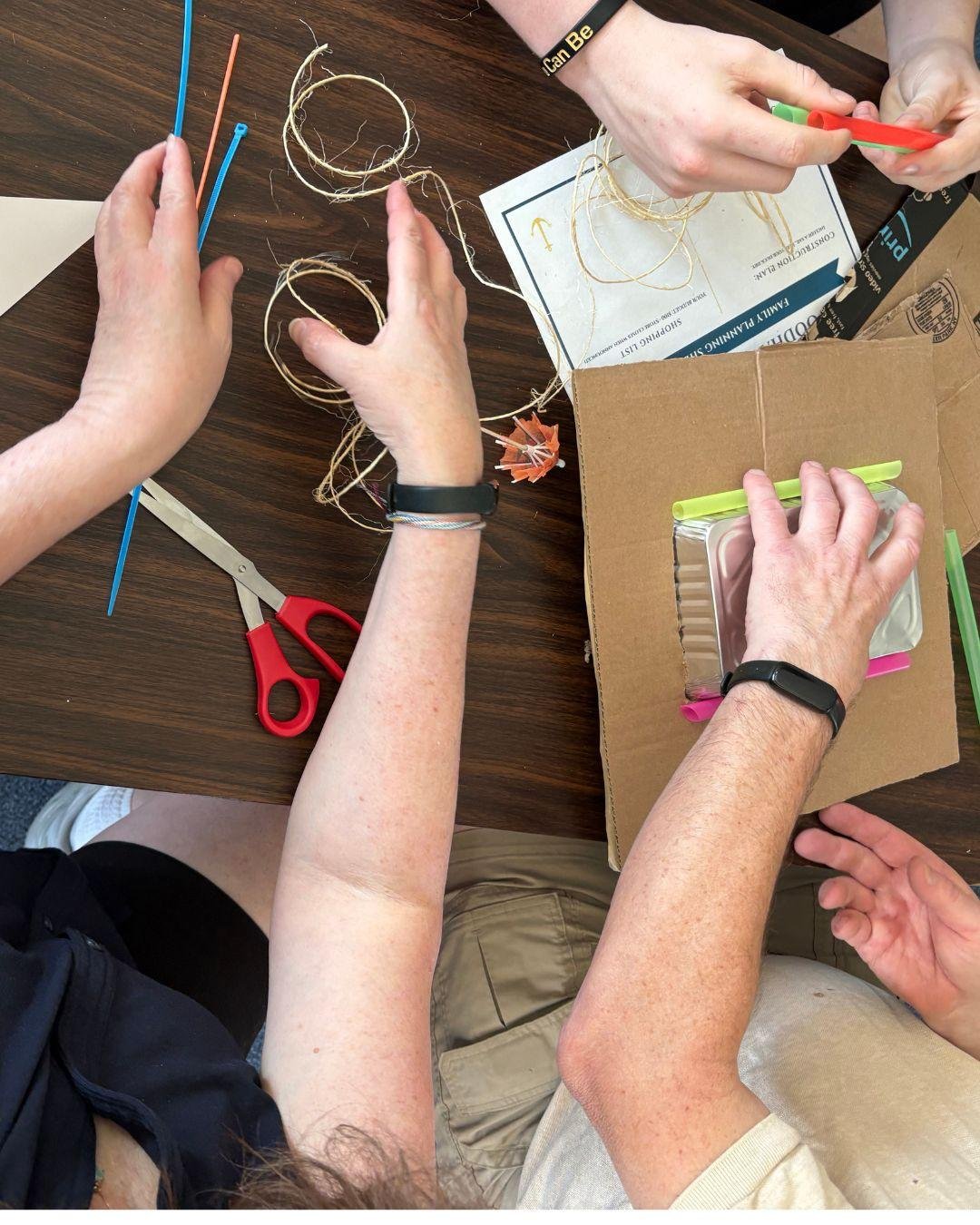 Families and students work together on a hands-on challenge during Family Day at Woodhaven Recovery, strengthening communication, teamwork, and connection.