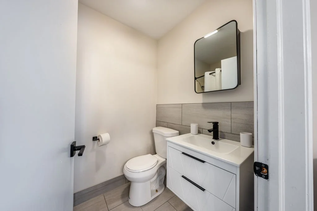 Renovated resident bathroom at Woodhaven Manor supporting privacy, dignity, and daily self-care.