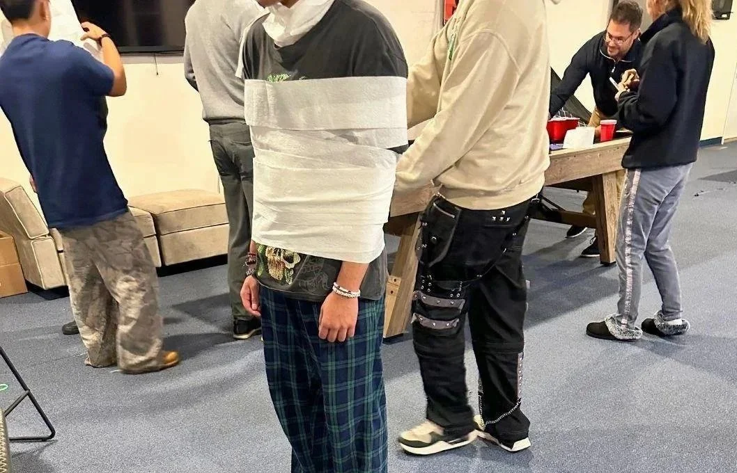 Teen boys participate in a team challenge at Woodhaven Recovery, building teamwork, connection, laughter, and sober fun. 