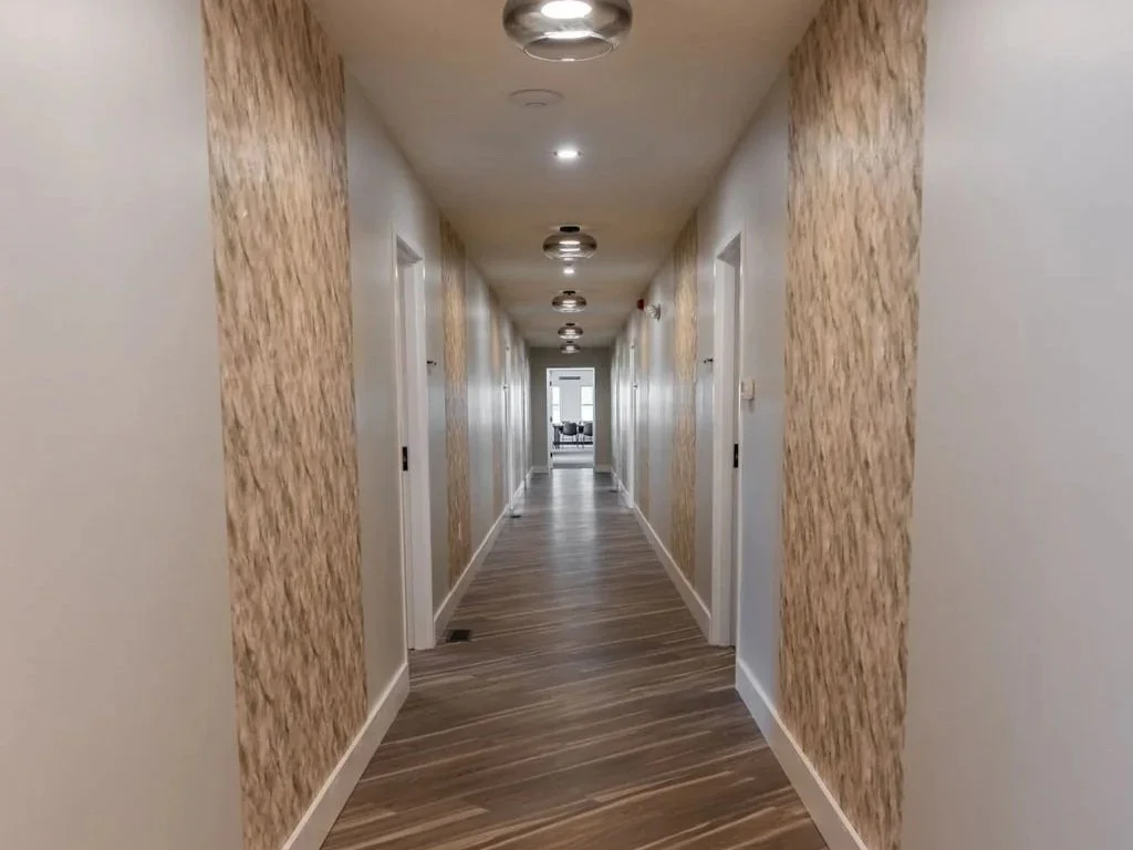 Hallway inside Woodhaven Manor where bedrooms and shared spaces are named to reflect recovery values.