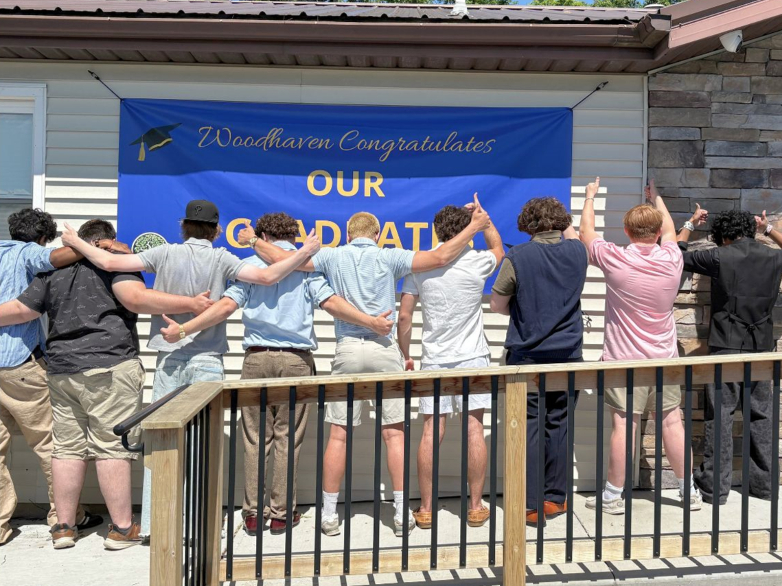 Woodhaven Prep Class of 2026 graduates celebrating together after graduation