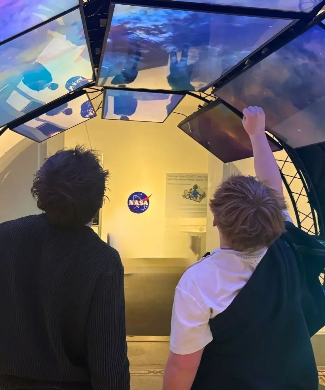 Woodhaven Prep students explore a NASA exhibit during an experiential learning trip that supports deeper academic challenge and curiosity.