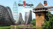 Six Flags Great Adventure entrance with roller coasters, representing summer recreation outings for Woodhaven residents.
