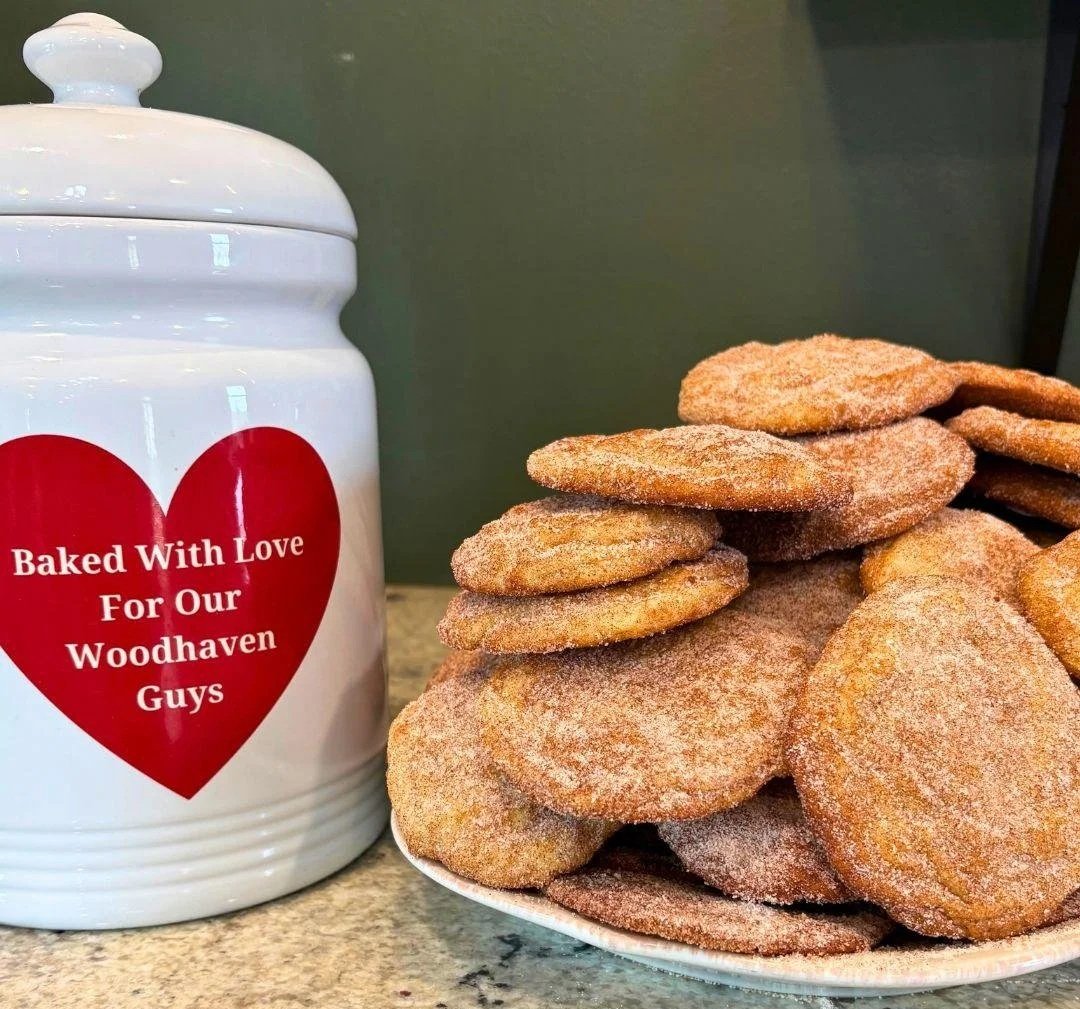 Freshly baked cookies beside a jar labeled “Baked With Love For Our Woodhaven Guys,” reflecting the warmth, care, and sense of community at Woodhaven Recovery.