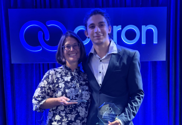 Caron Foundation award recipients pose with their awards during a recognition event.