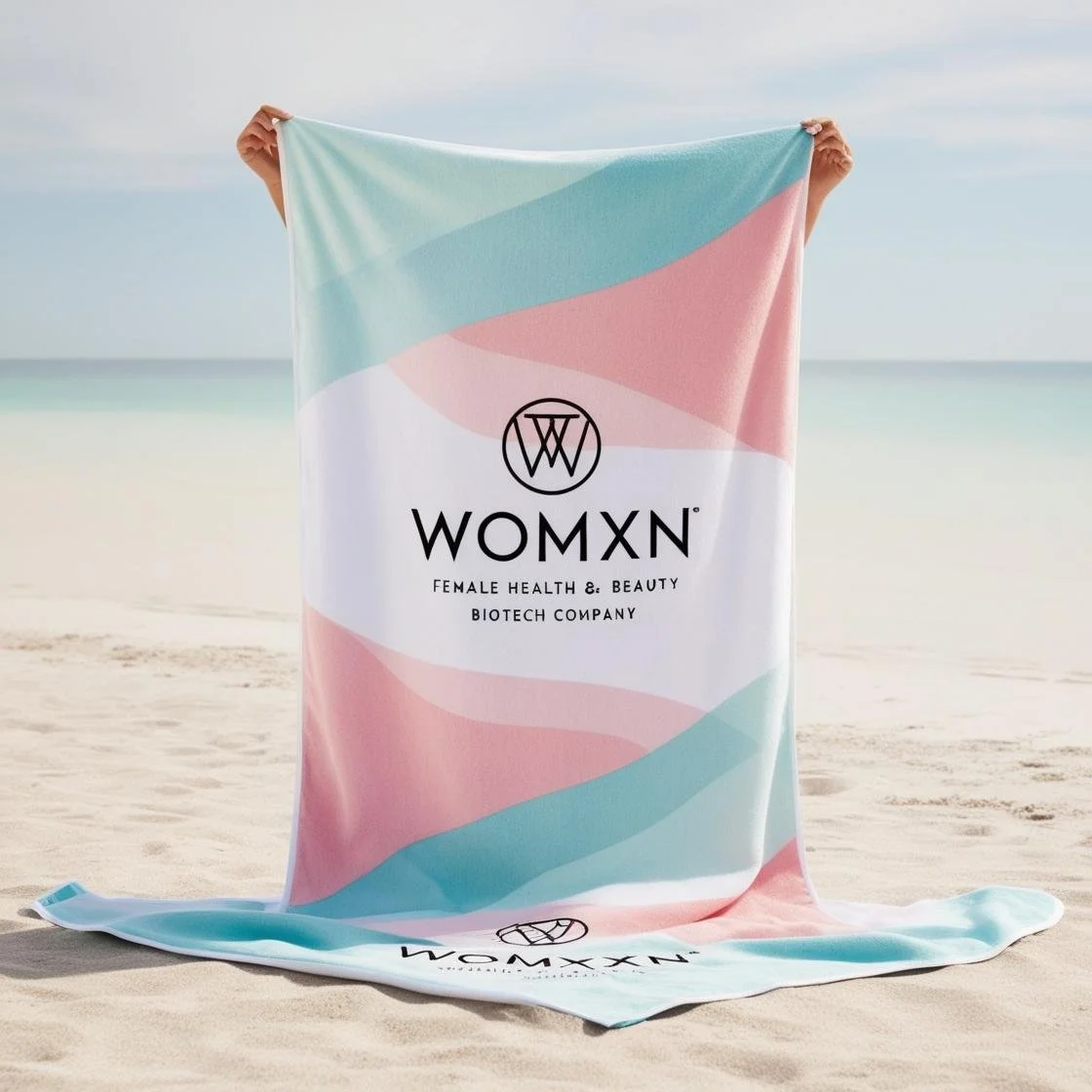 %22womxn%22 is a female health, beauty biotech company. create a branded lux beach towel. use pink somewhere, ice blue, pale aqua-4.jpg