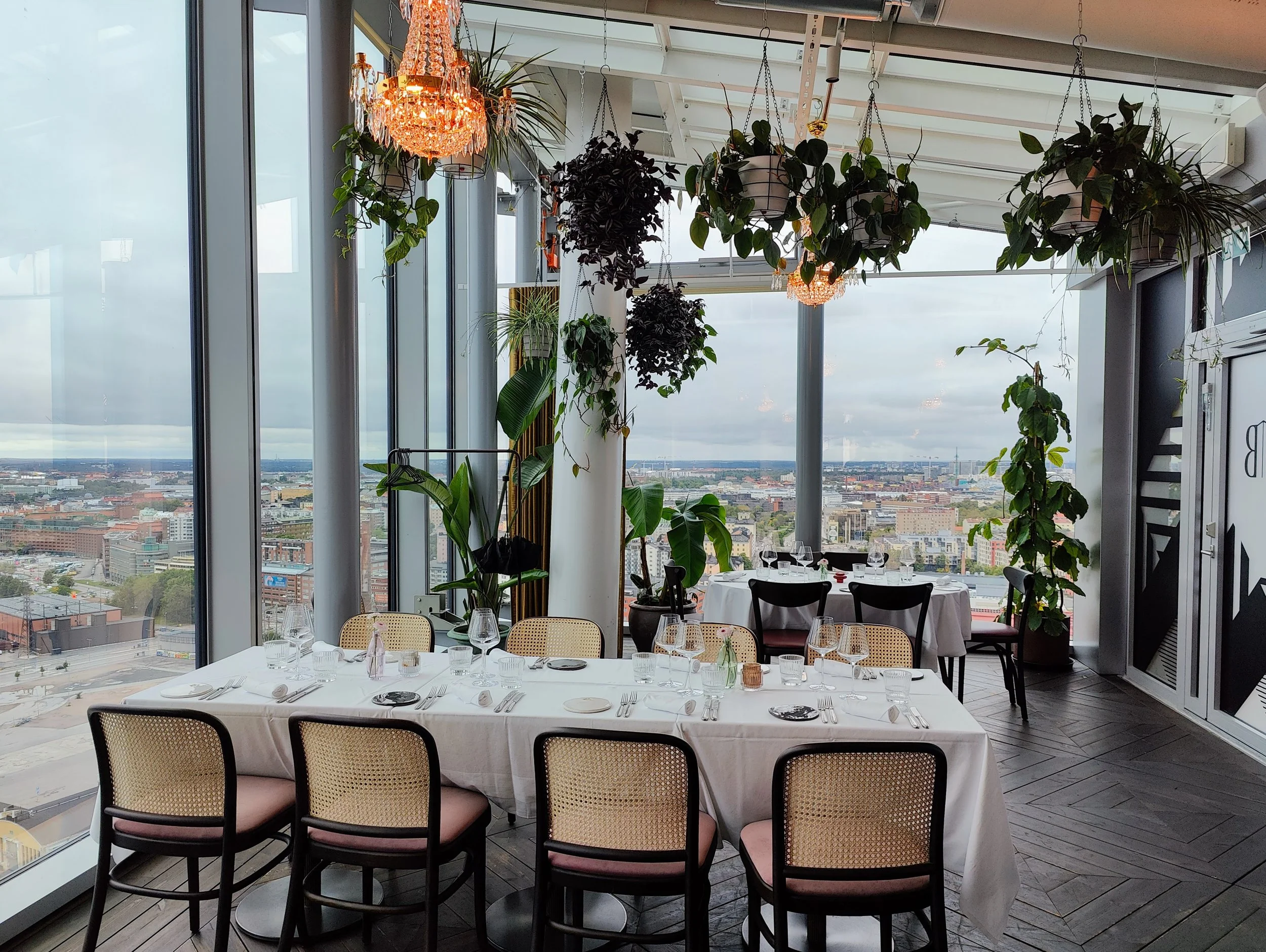 Restaurant seating area with large windows
