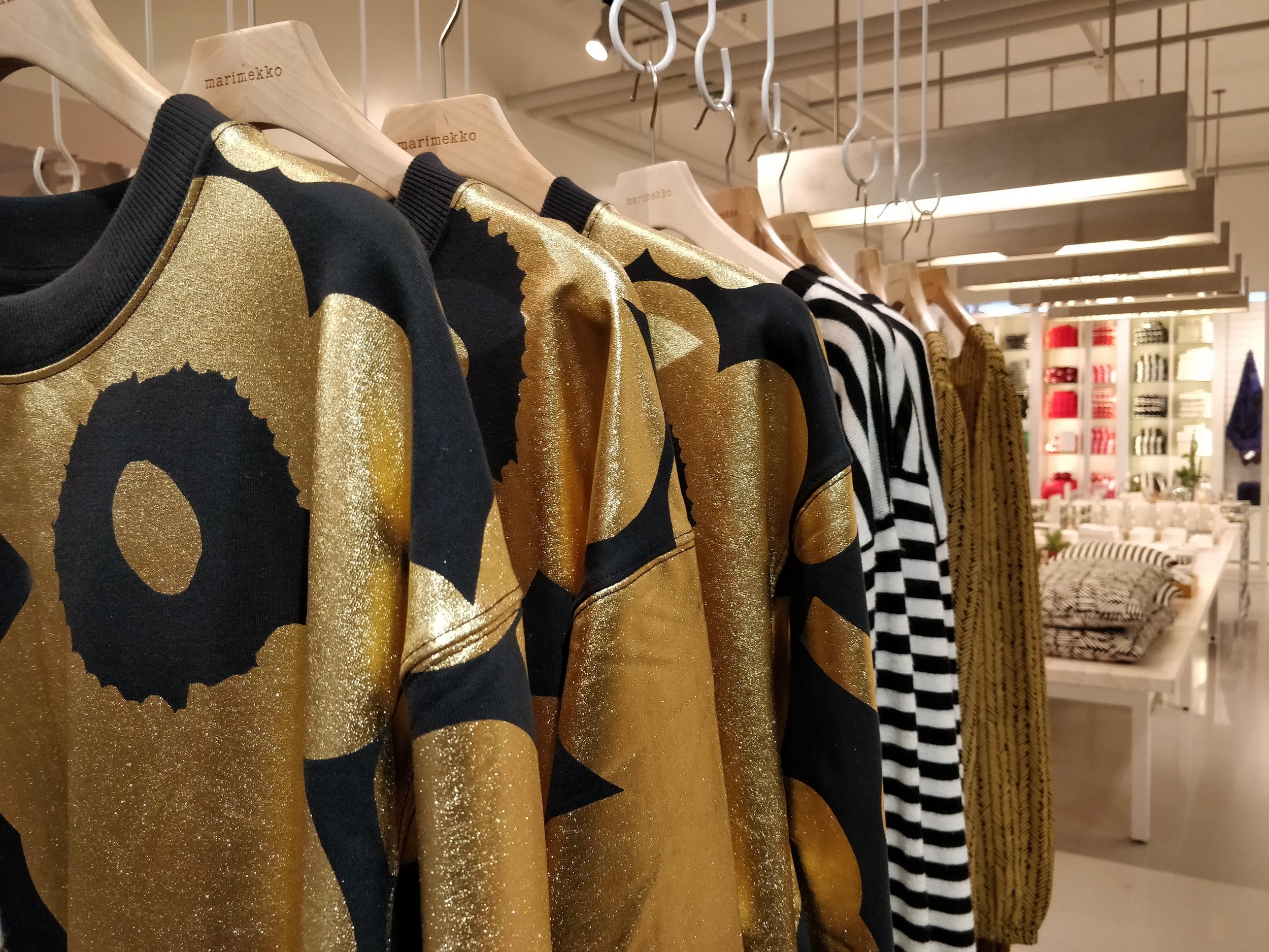 Marimekko gold and black clothes in the store