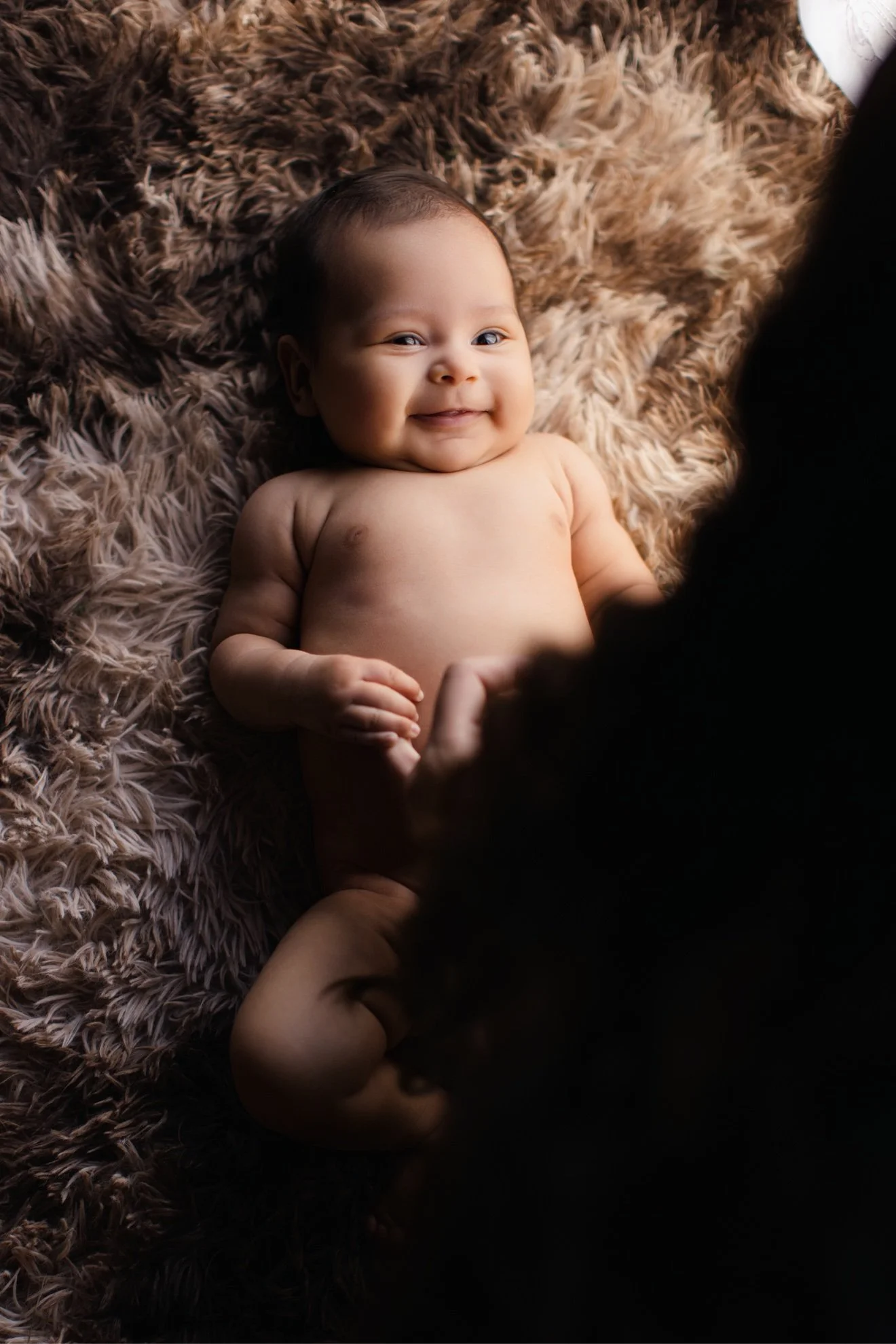 01-newborn-rug-smile.jpg