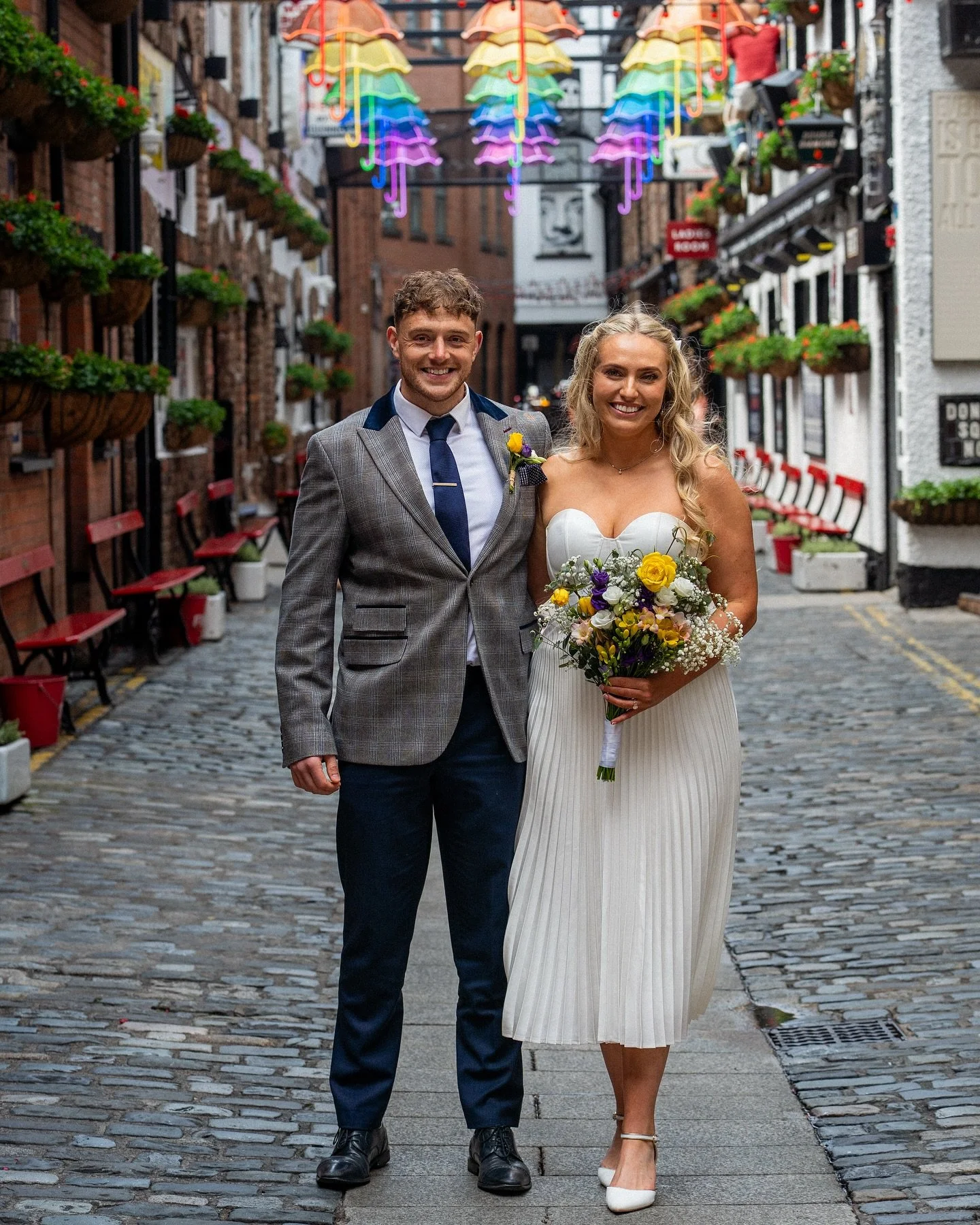 Belfast charm. Cobbled streets. Just married

Now taking wedding bookings across Northern Ireland for 2026 &amp; 2027 

#commercialstreet #umbrellastreet #cathedralquarter #dukeofyork #justmarried #weddingphotographers #northernireland #belfast