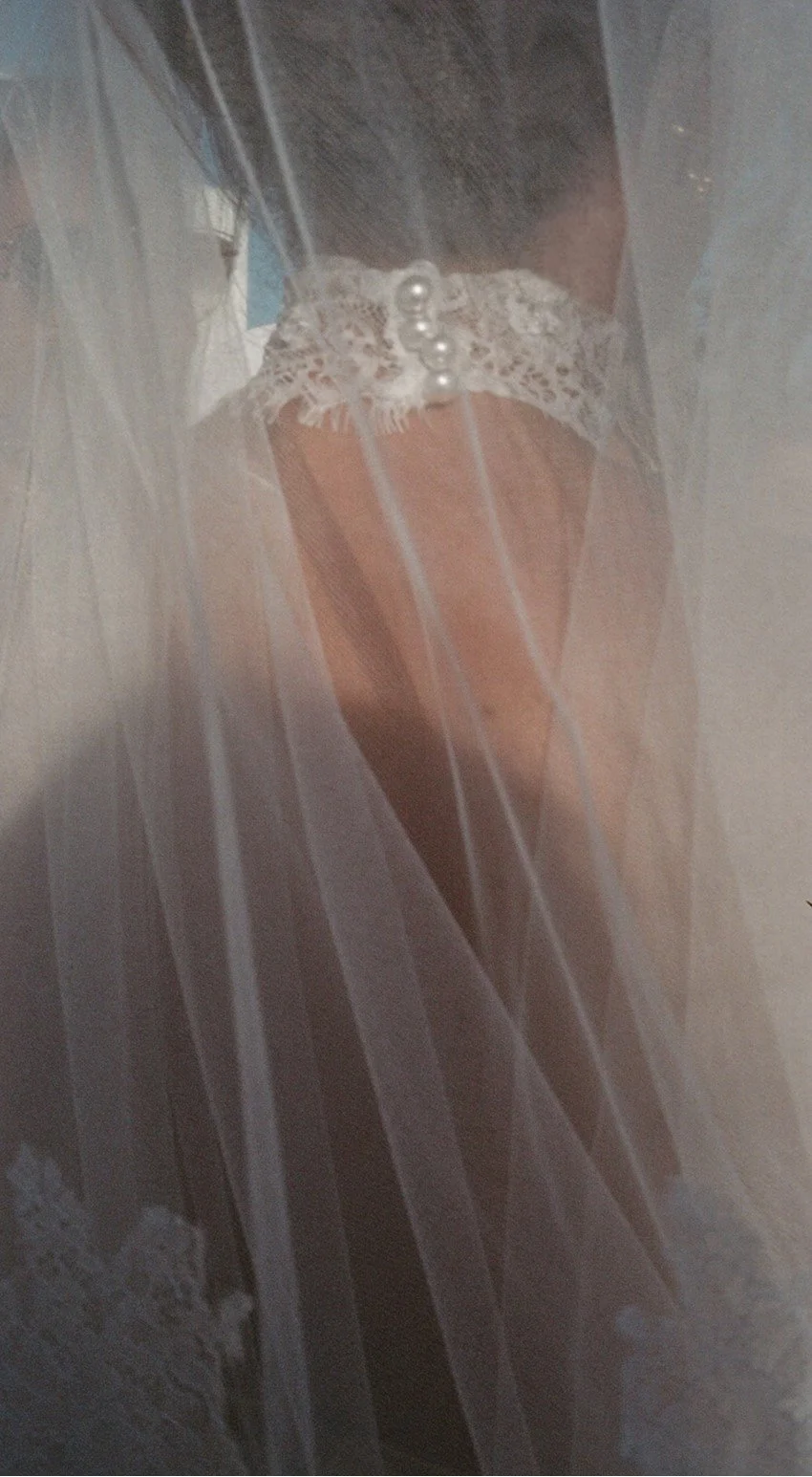 Close-up of veil and white lace Berta Bride choker neck detailing