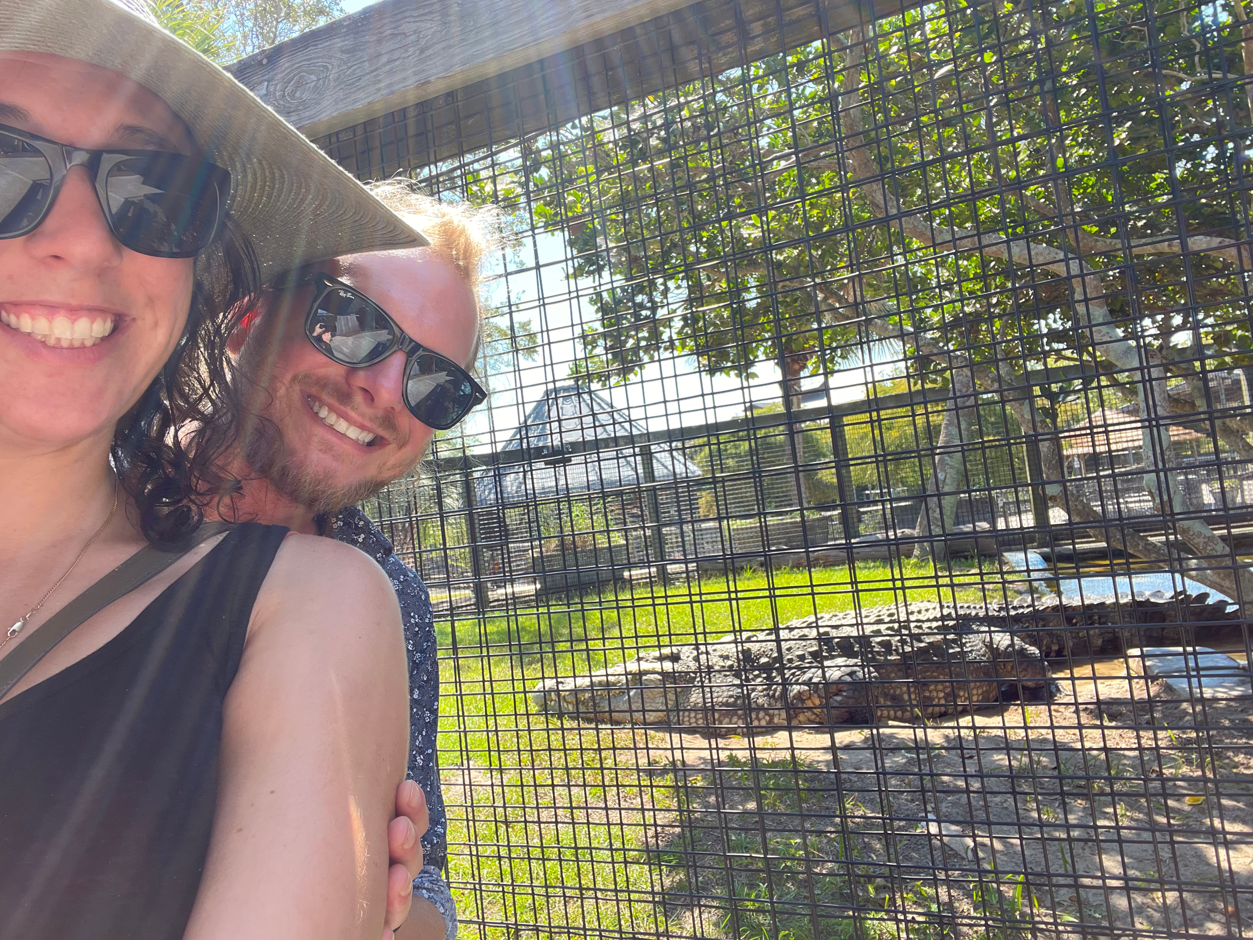 Owners of Lakeview Gallery & Gardens, Faith and Ryan Byrd smiling and taking a selfie with Utan, King of the Crocs.
