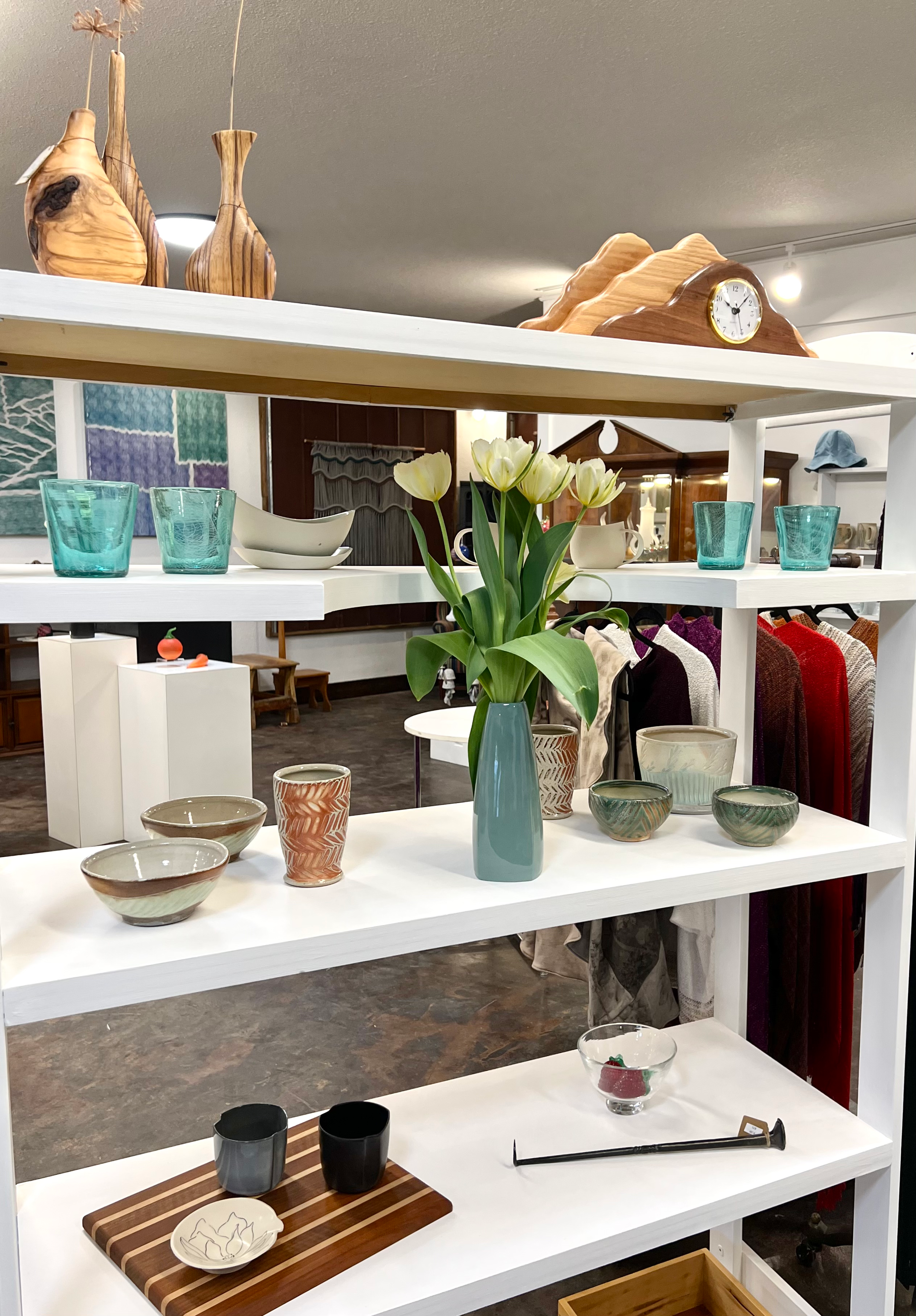Display of various ceramic and glassware items, including bowls, cups, and vases made by local artists of Mitchell County, NC. In the toadshade gallery at Lakeview Gallery and Gardens.