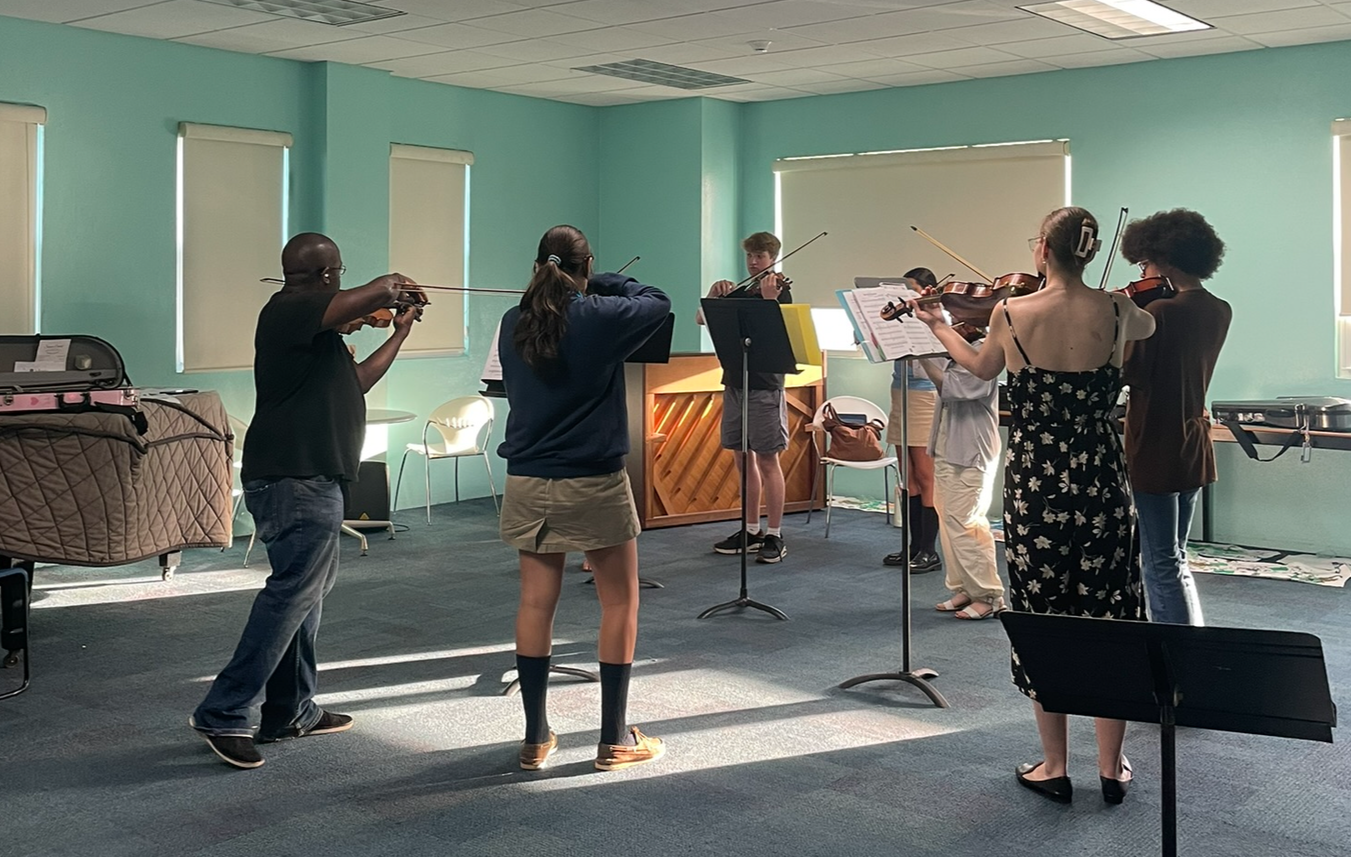 Students work with guest artist Carolyn Farnand, principal violist of the Nova Scotia Symphony, in a chamber music coaching focused on listening and ensemble playing.