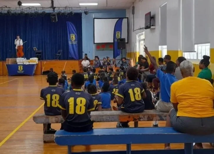 Isaiah Pennington, festival director, leads a Q&A with students at Victor Scott Primary School following a performance.