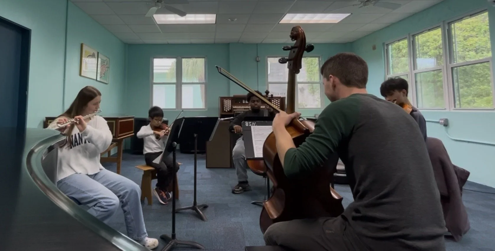 Isaiah Pennington leads a coaching on the Mozart Flute Quartet, part of the festival’s effort to provide young ensembles with opportunities to develop and be showcased.
