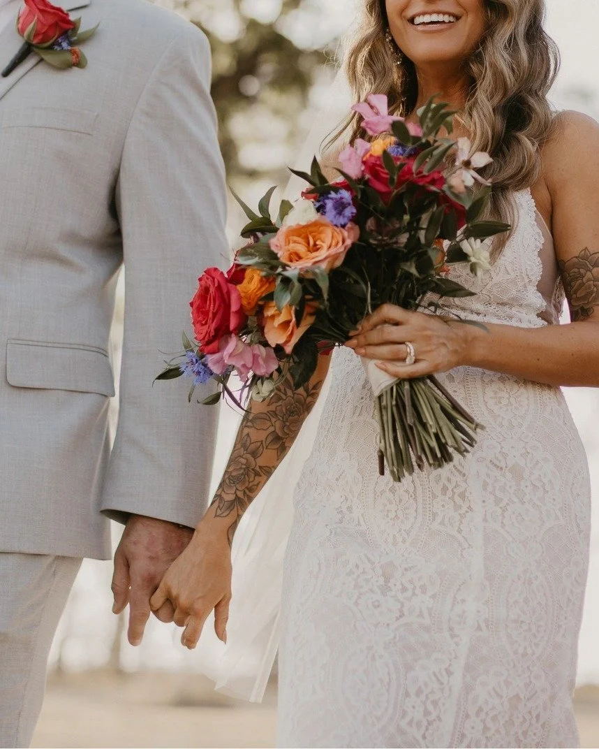 "It's a wedding in the country, not a country wedding" ~ Bride
Assignment understood 🫡
An October wedding does *not* have to be Fall-themed, so we opted for a warm and vibrant aesthetic by using bold and bright colors, mixing patterns an