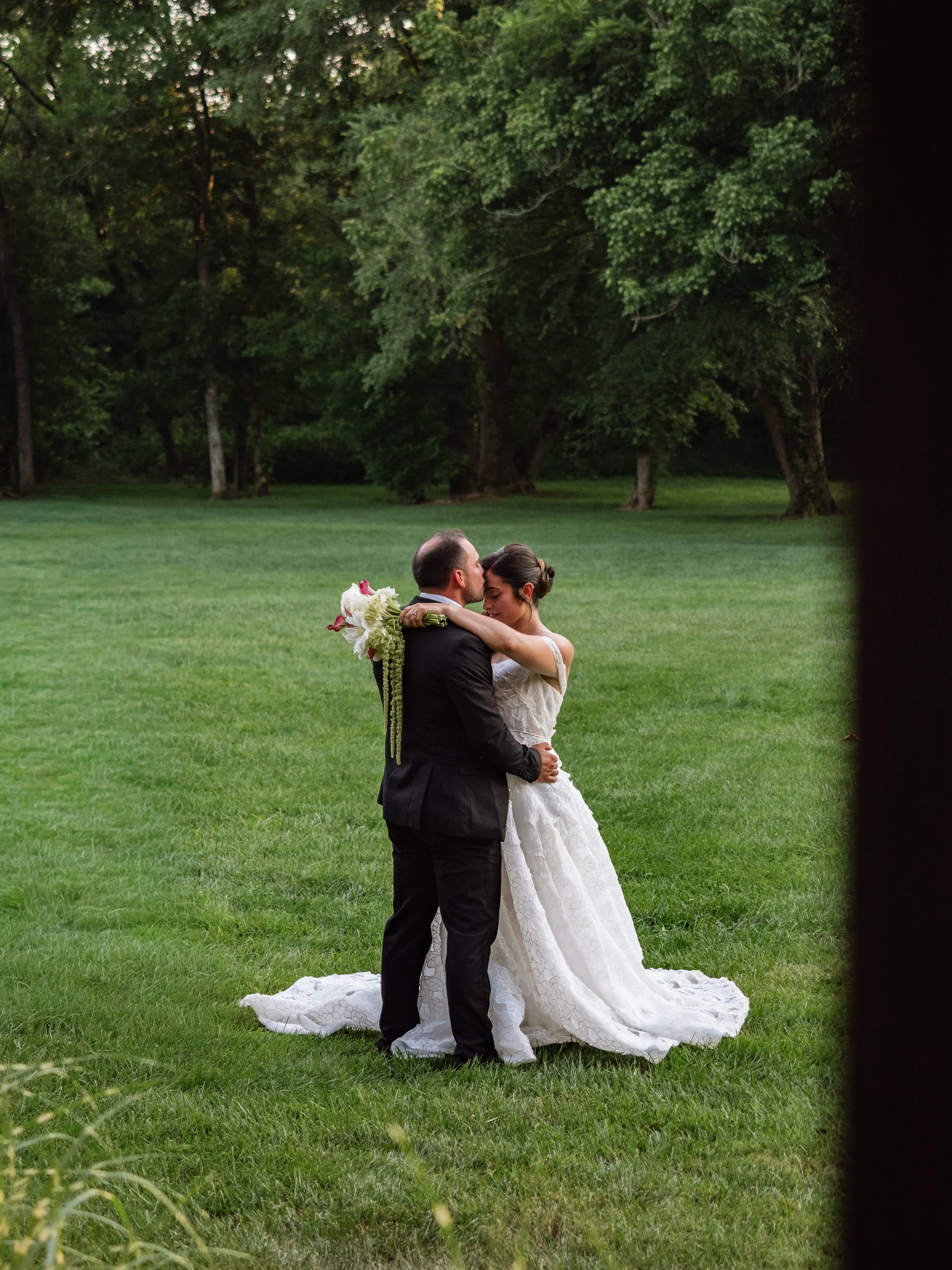 Couple hugging on the lawn at providence cotton mill..jpg