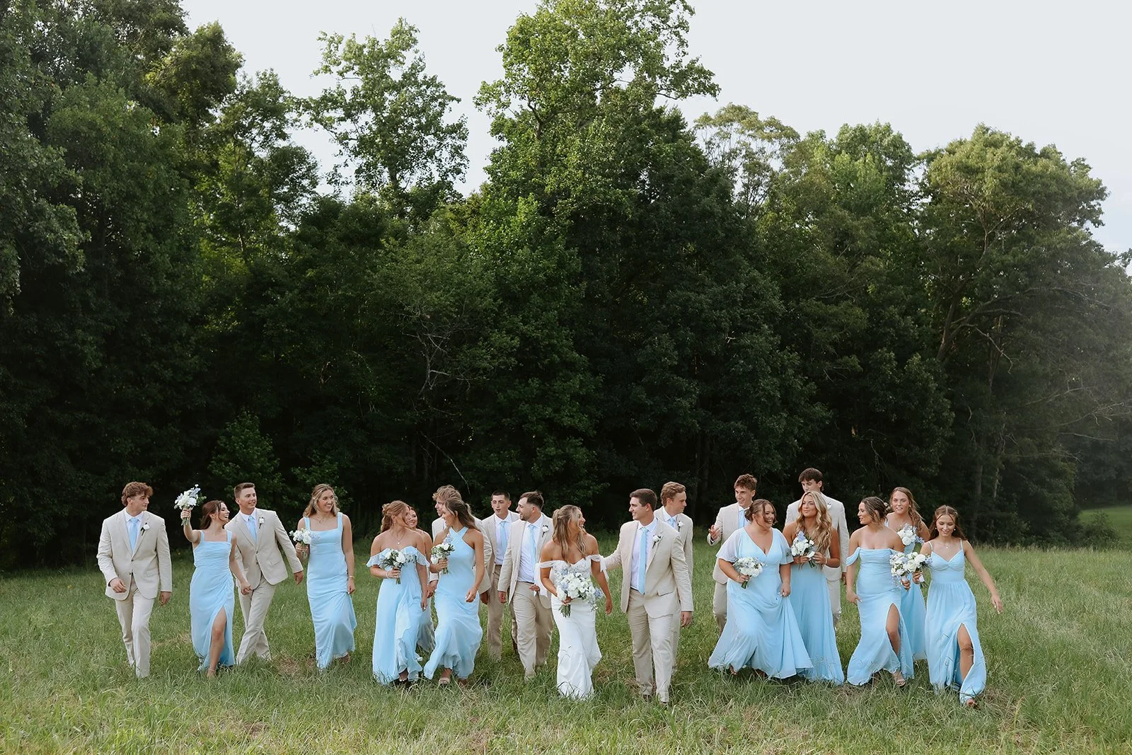 White and light blue wedding party at The Barn at Blue Sky Farm in Dallas, NC. Charlotte florist. Blue and white wedding flowers. Blue bridesmaid bouquets.