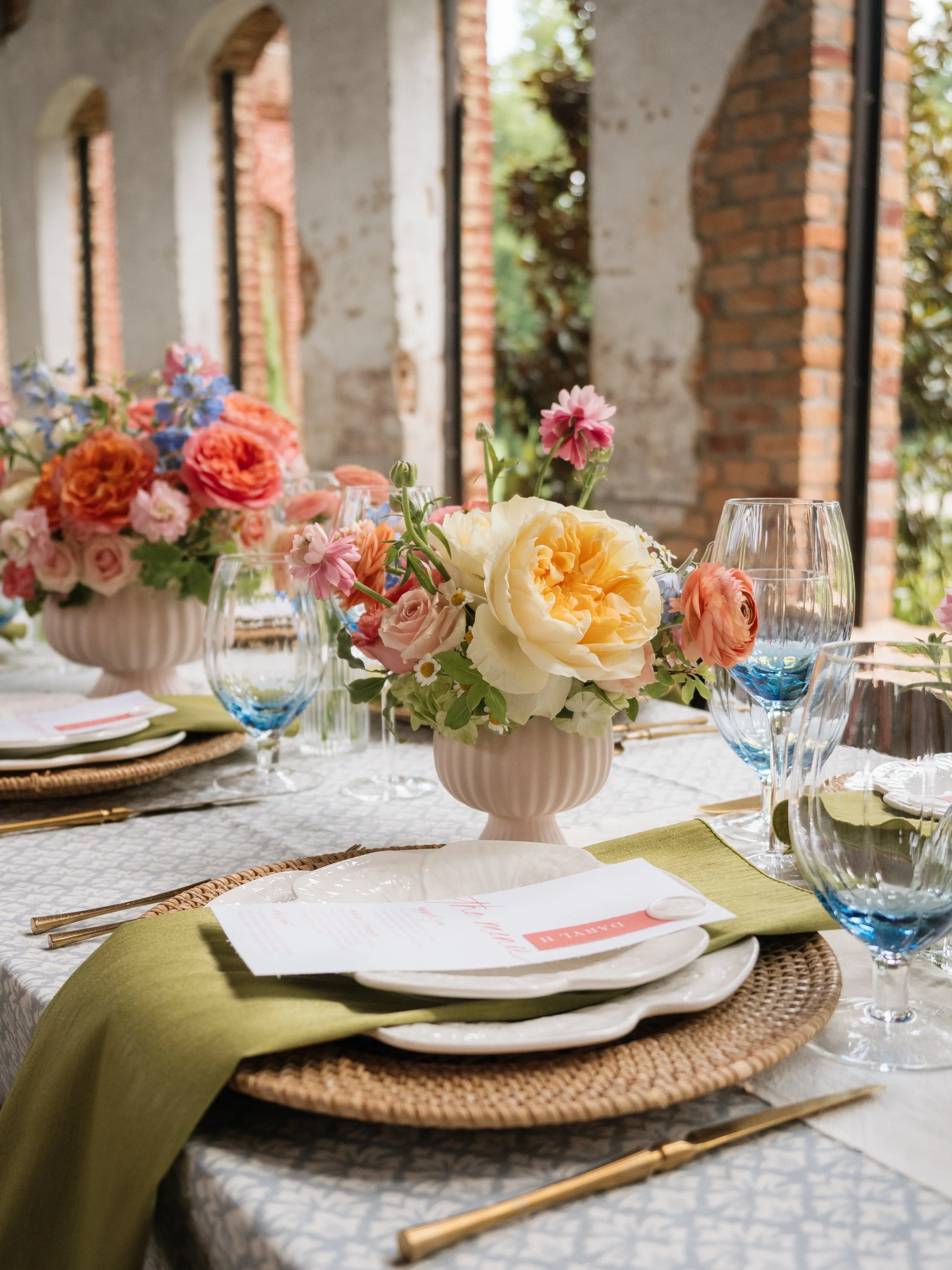 Butter yellow and pink garden rose centerpiece in blush vase..jpg