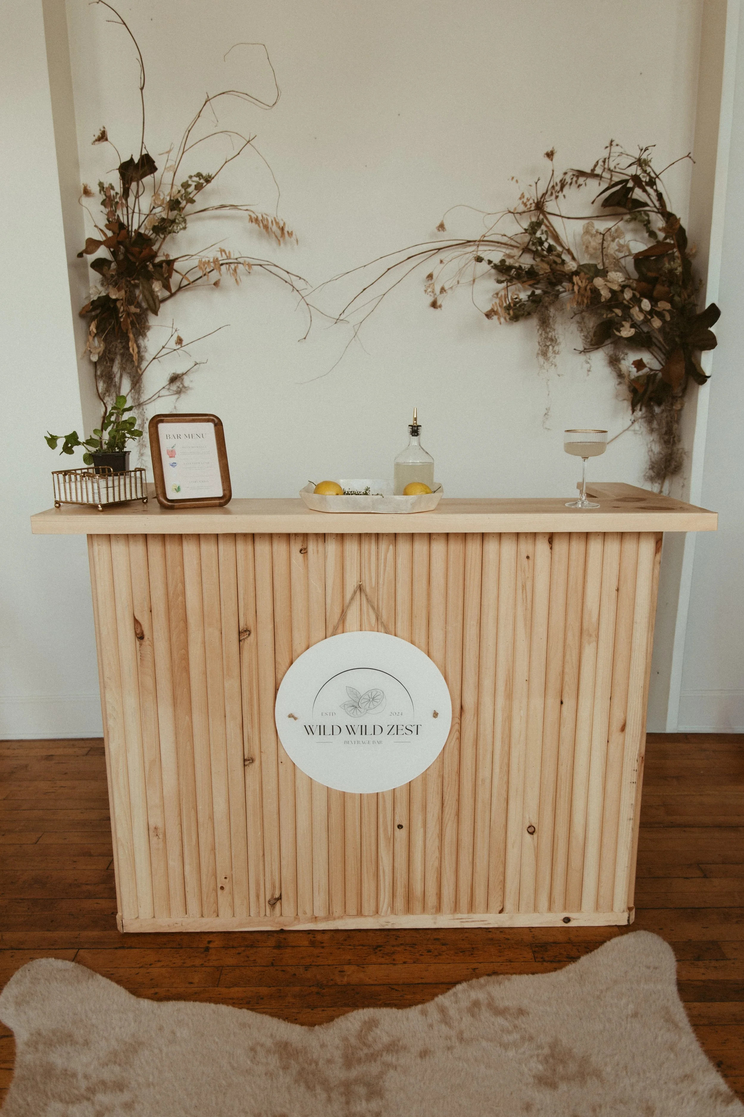 Wooden custom portable bar in rustic wedding venue in Connecticut 