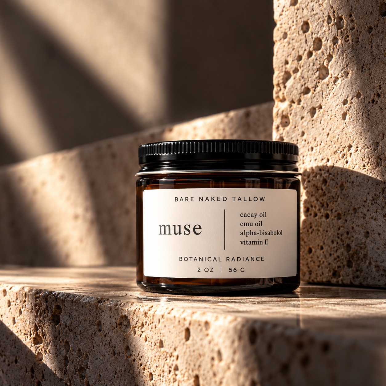 A dark amber jar with a black lid and label, containing a skincare product called 'Muse' by Bare Naked Tallow, placed on white satin fabric.