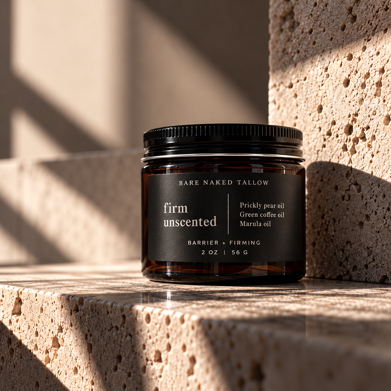 A dark brown jar of Bare Naked Tallow Firm Unscented Brightening & Collagen skincare cream with a black lid, placed on a rustic wooden surface with rocks and dried plants around it.