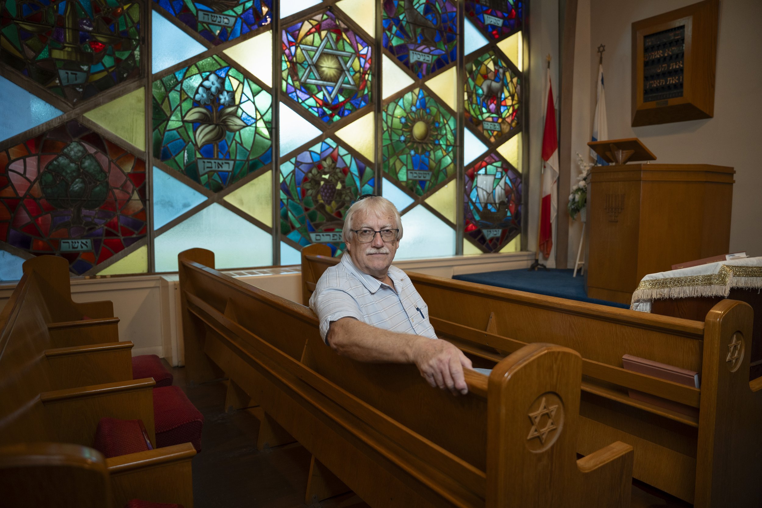 Norman Weddum, volunteer president of the Sons of Jacob synagogue, sits in the sanctuary where he ducked for cover during its recent Yom Kippur services when gunfire poured in from outside. Sept 24, 2026. DAVID LECLAIR / THE GLOBE AND MAIL