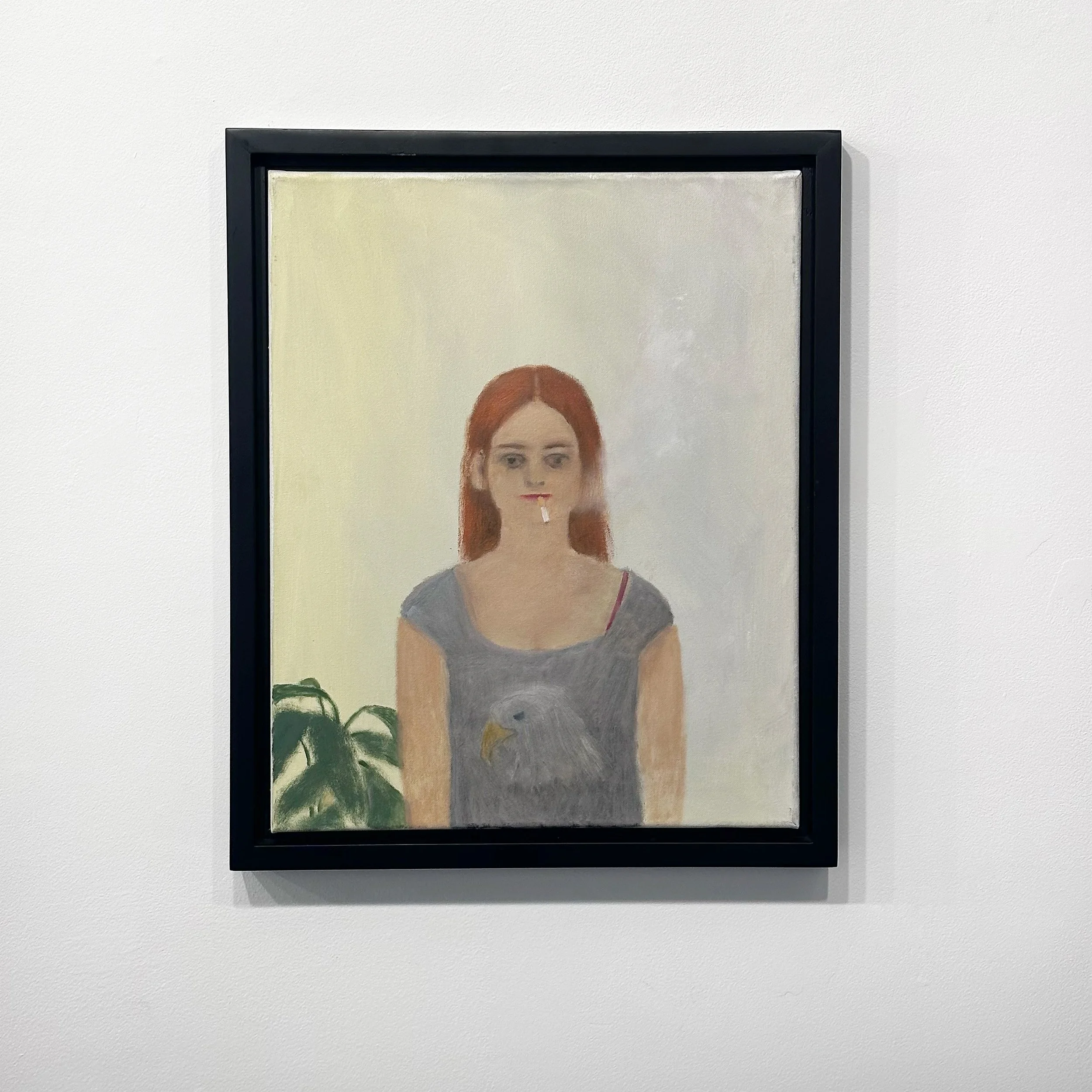 Girl in eagle shirt smoking