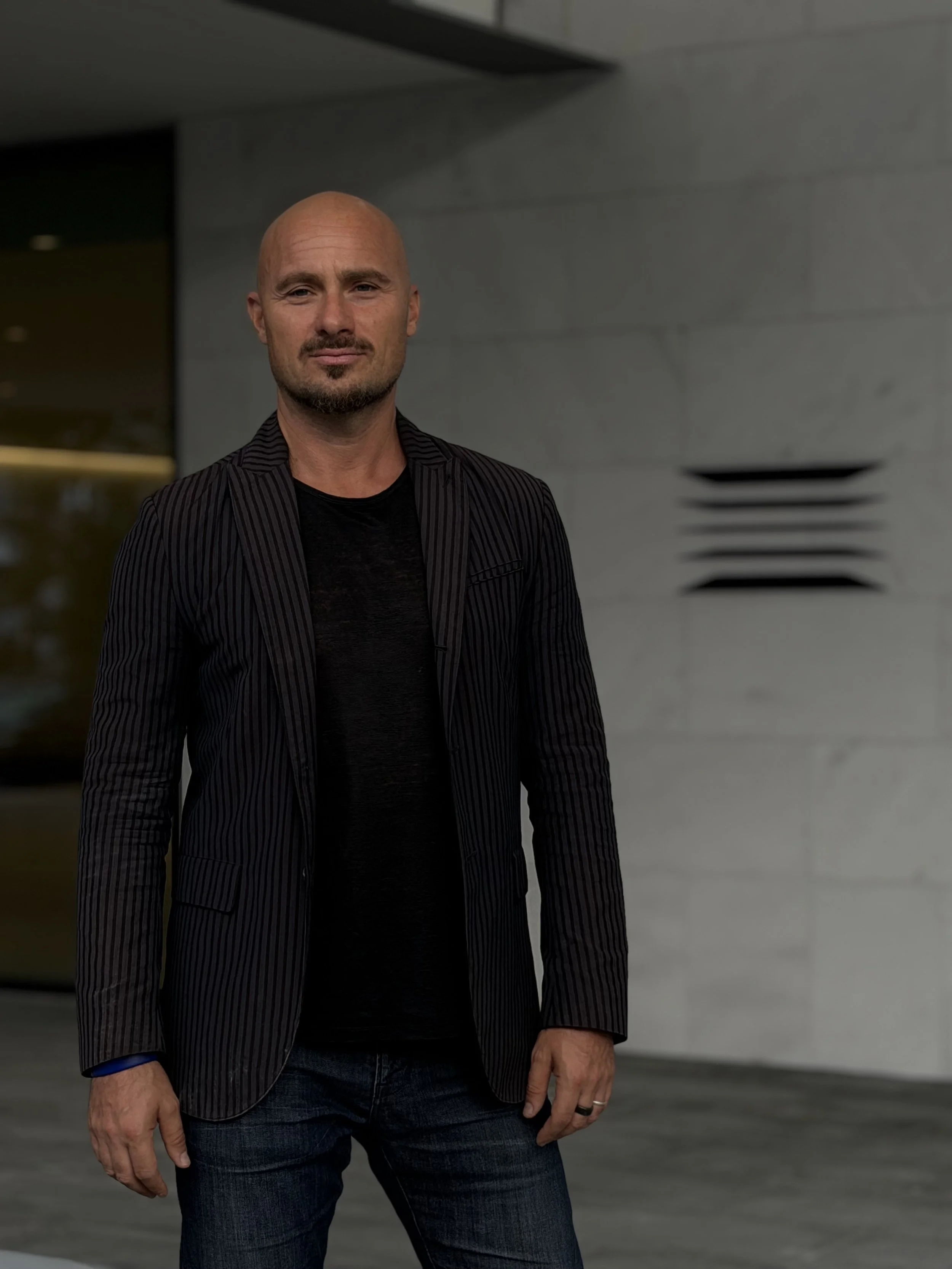 Photo of Developer Jacob Abramson  in front of Miami Beach commercial building The Fifth in South Beach