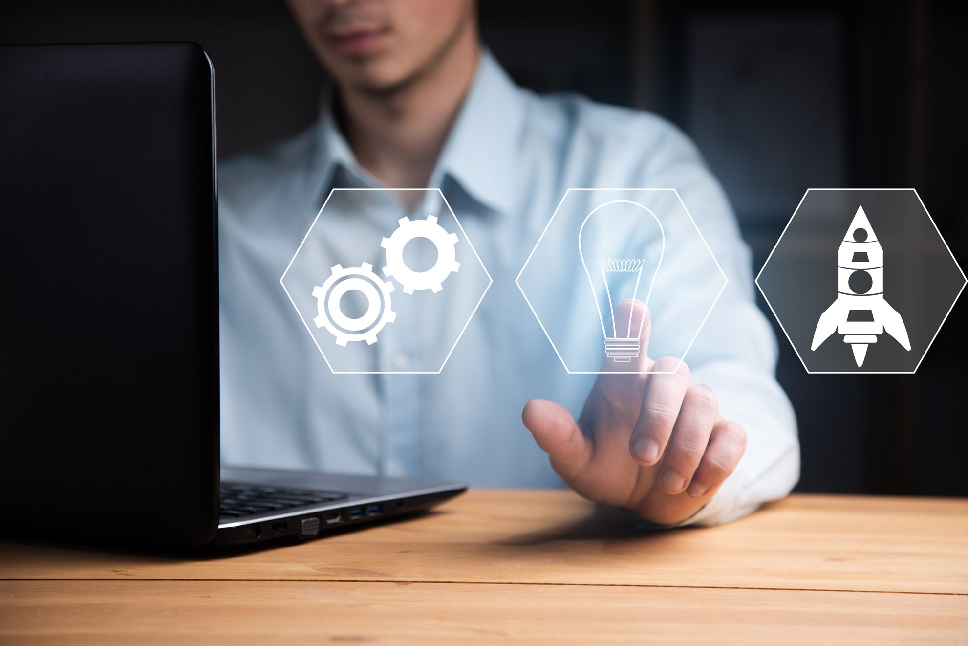 business-man-working-computer-with-start-up-icon (1).jpg