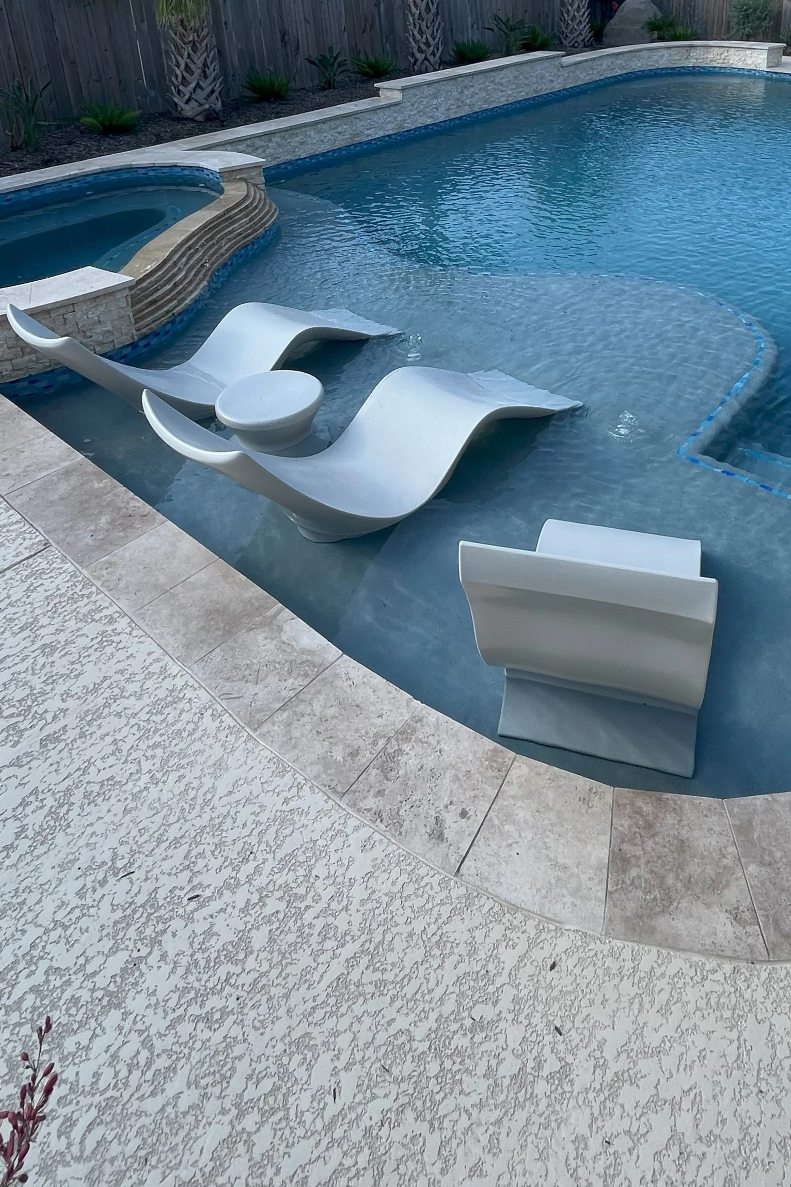 Riverstone Ranch in Houston custom swimming pool and spa with tanning ledge