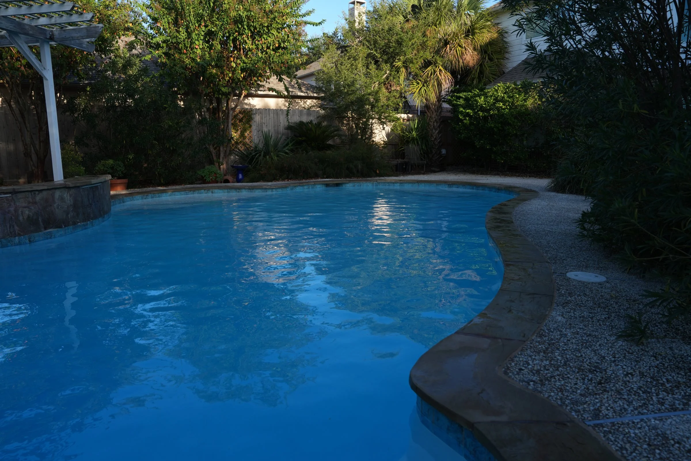 South Shore Harbor pool finish refresh with white plaster and renewed coping.