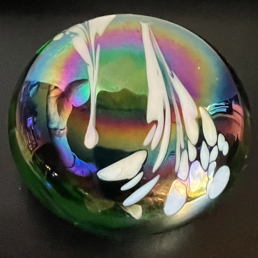 Glass paperweight with iridized ash from Mount St. Helens