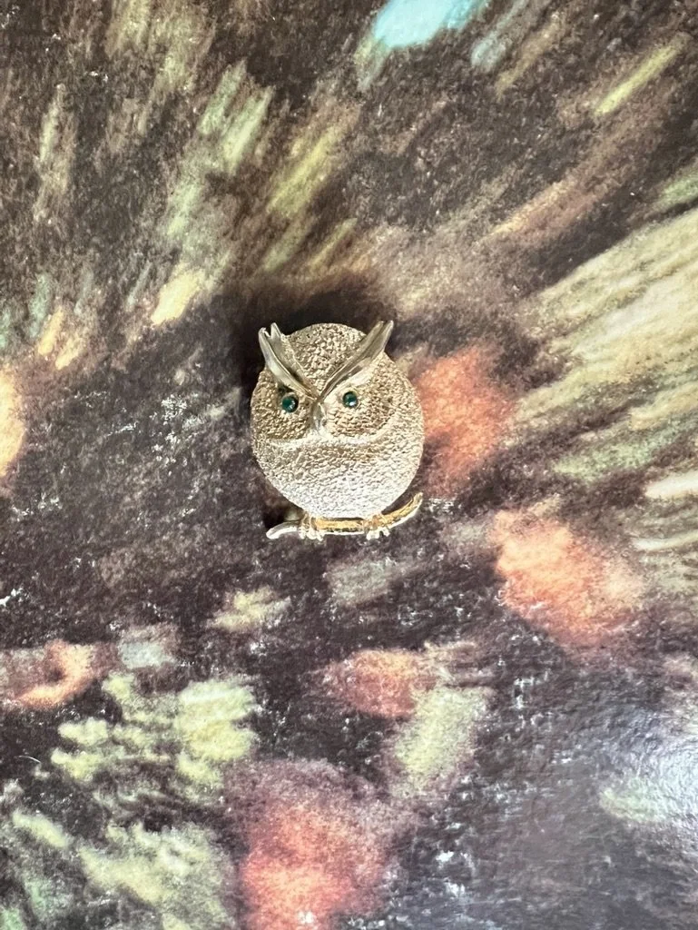 Owl brooch with green eyes