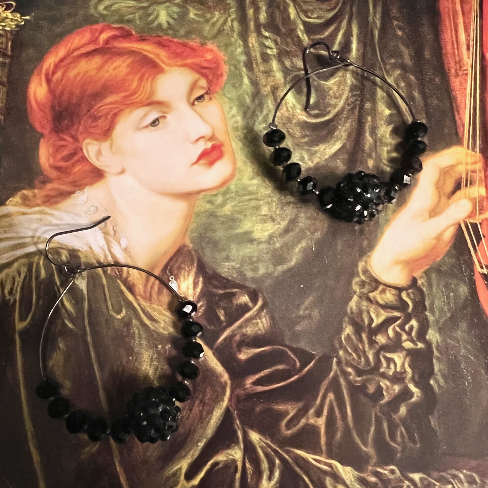 Earrings: black beaded hoops on fishhooks