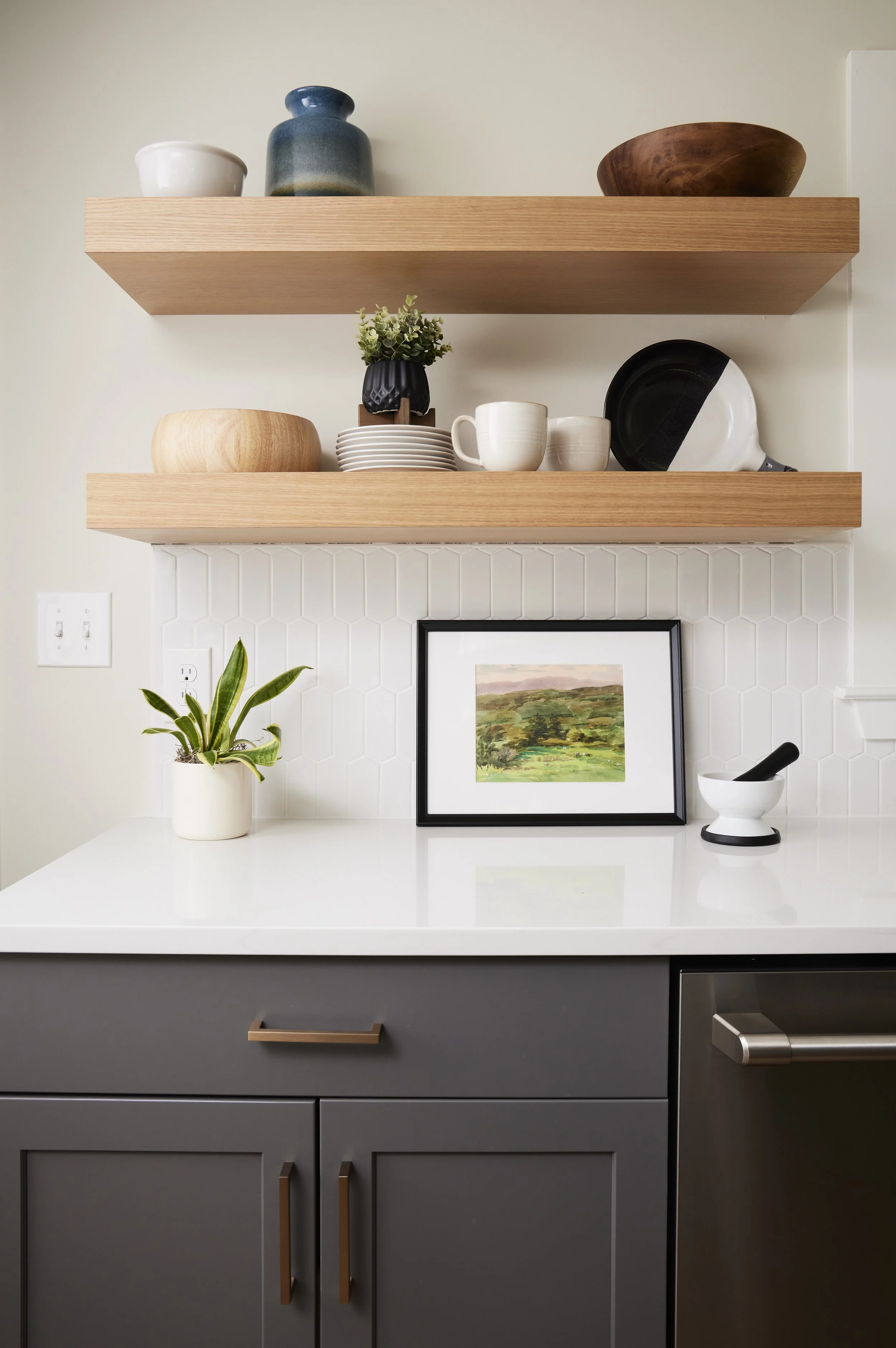 floating white oak shelves in bright, airy kitchen