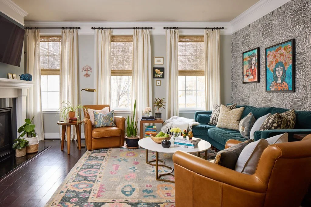 playful living room with fun colorful rug and client's original art