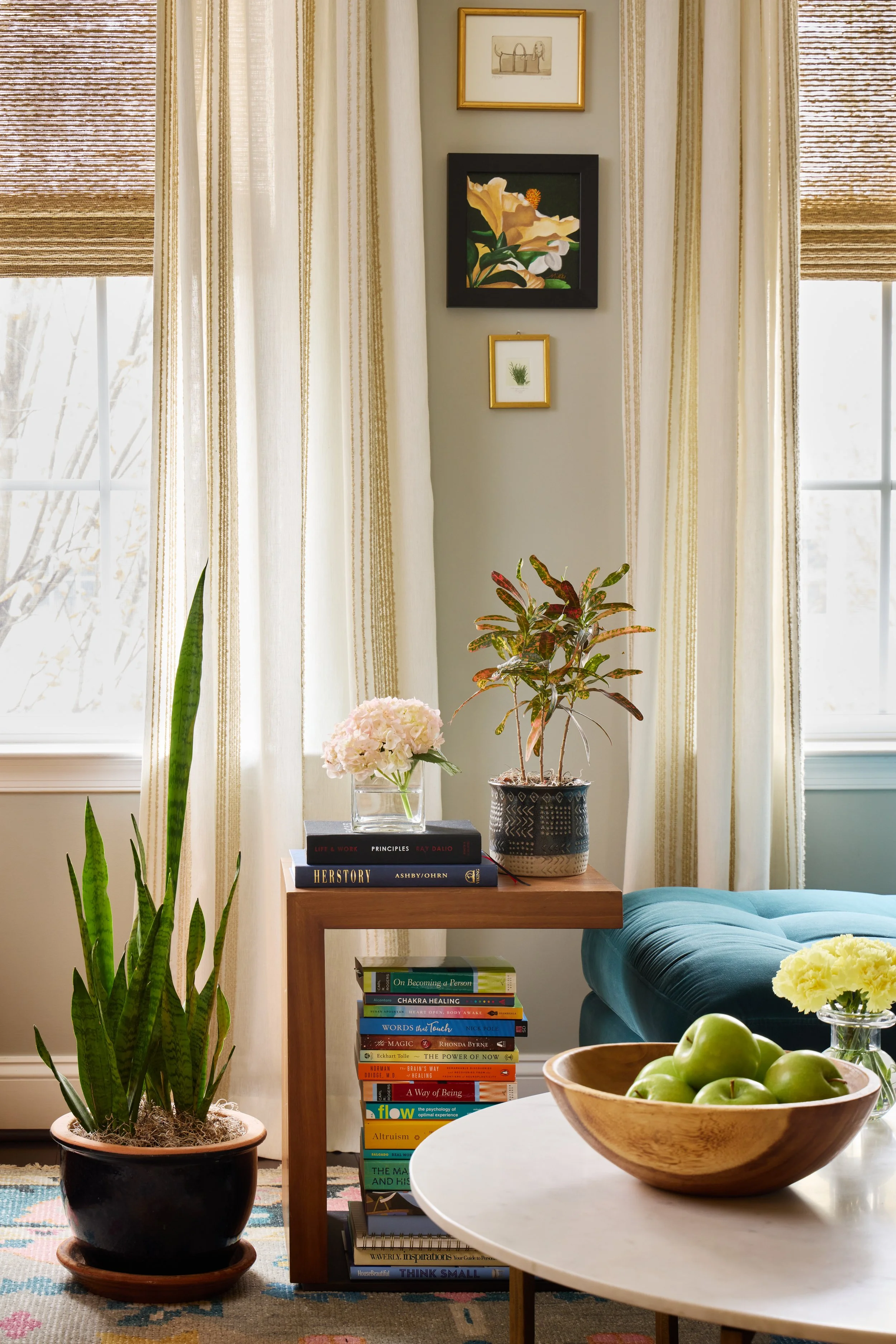 soft drapery behind a collection of books and accessories