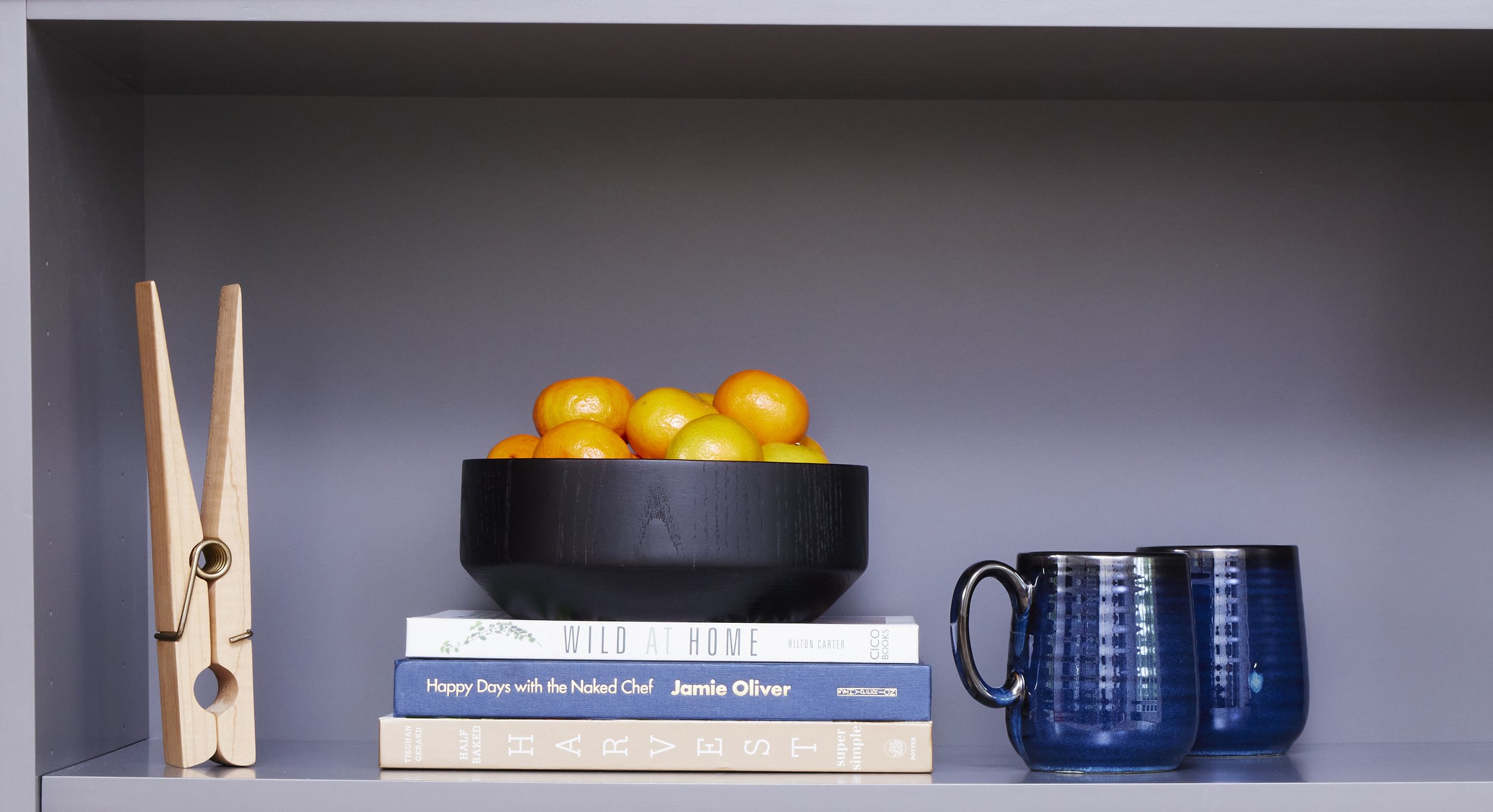 shelving display in large grey kitchen island