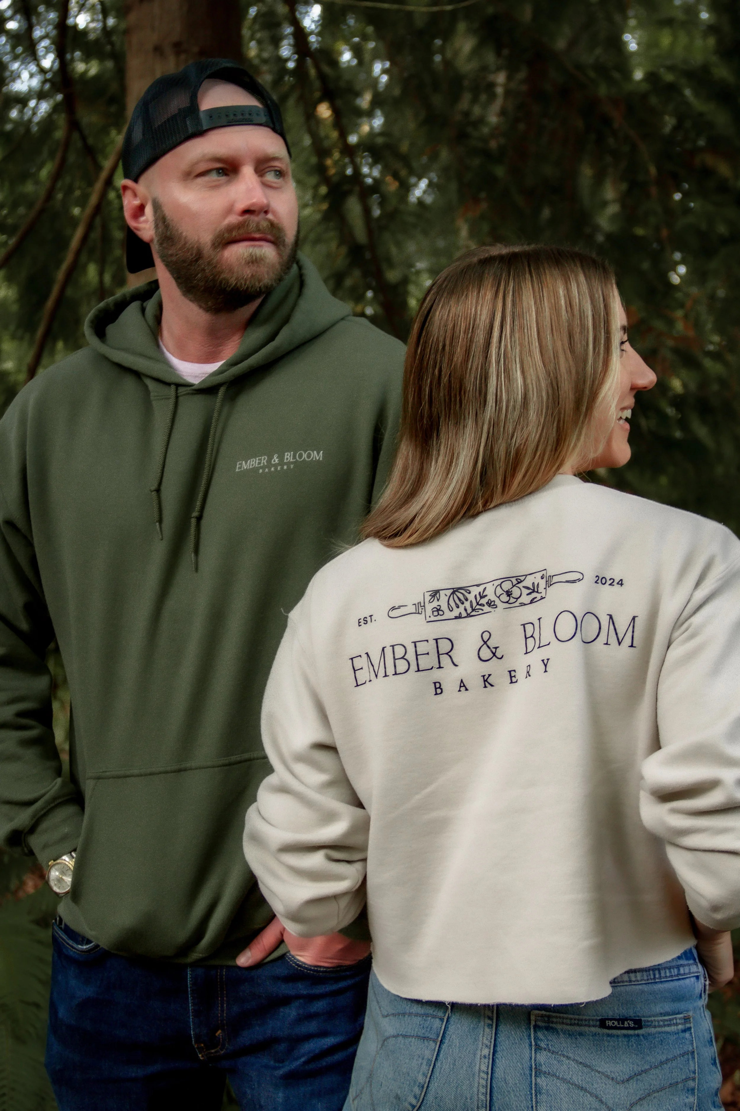 An image of Brittany Bailey, owner of Ember and Bloom and her fiance sporting the Ember & Bloom merchandise line at Kopachuck State Park in Gig Harbor.
