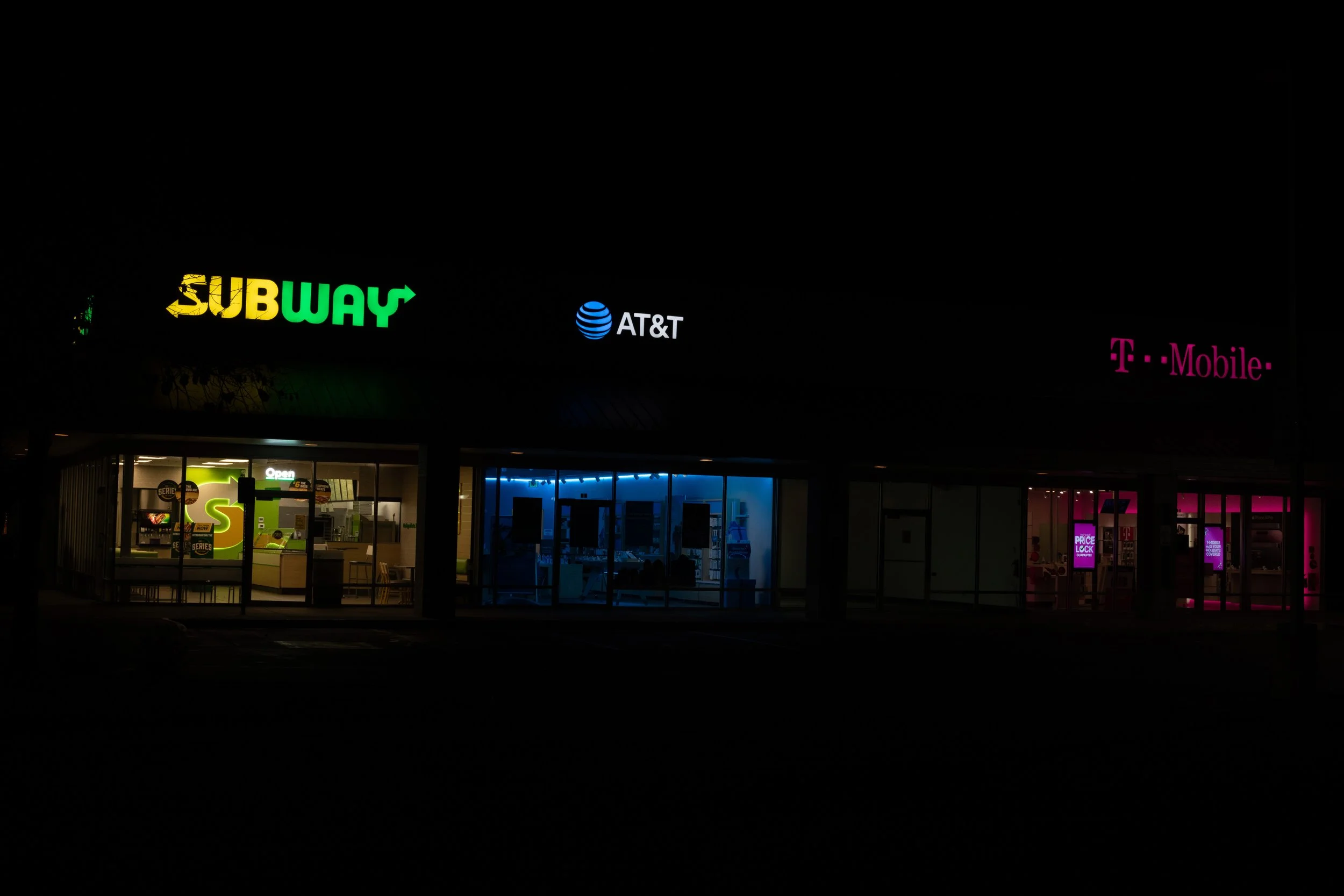 Strip mall at night, Denver, CO