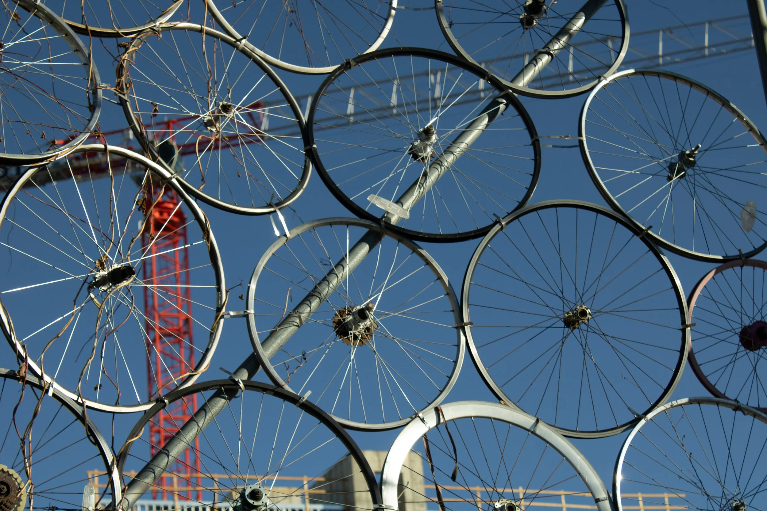 Wheel rims, spoke grid, red crane, Denver, CO
