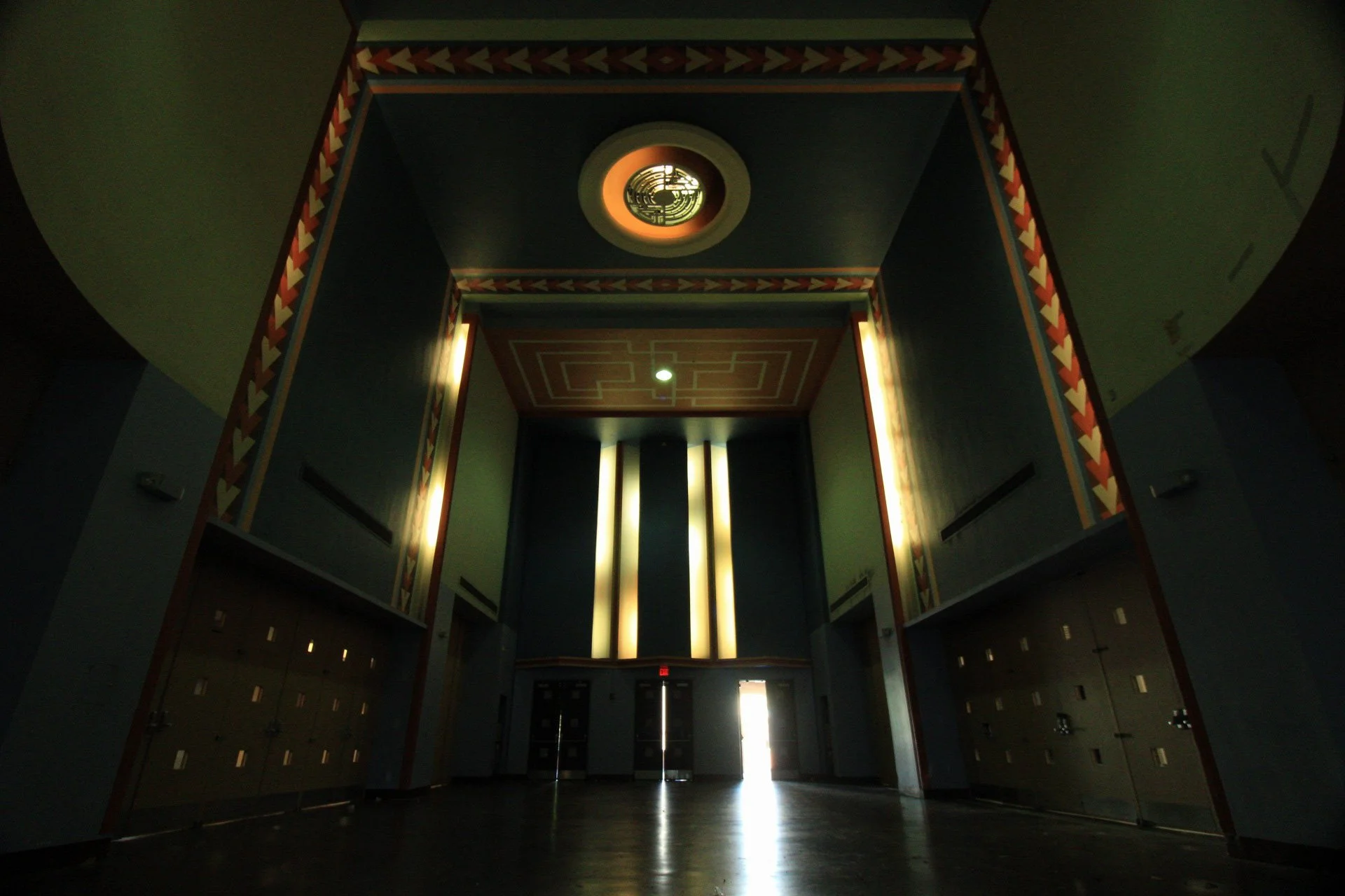Art Deco lobby with painted friezes, glowing pilasters, and circular ceiling medallion, Creative Arts Building, Fair Park, Dallas, TX