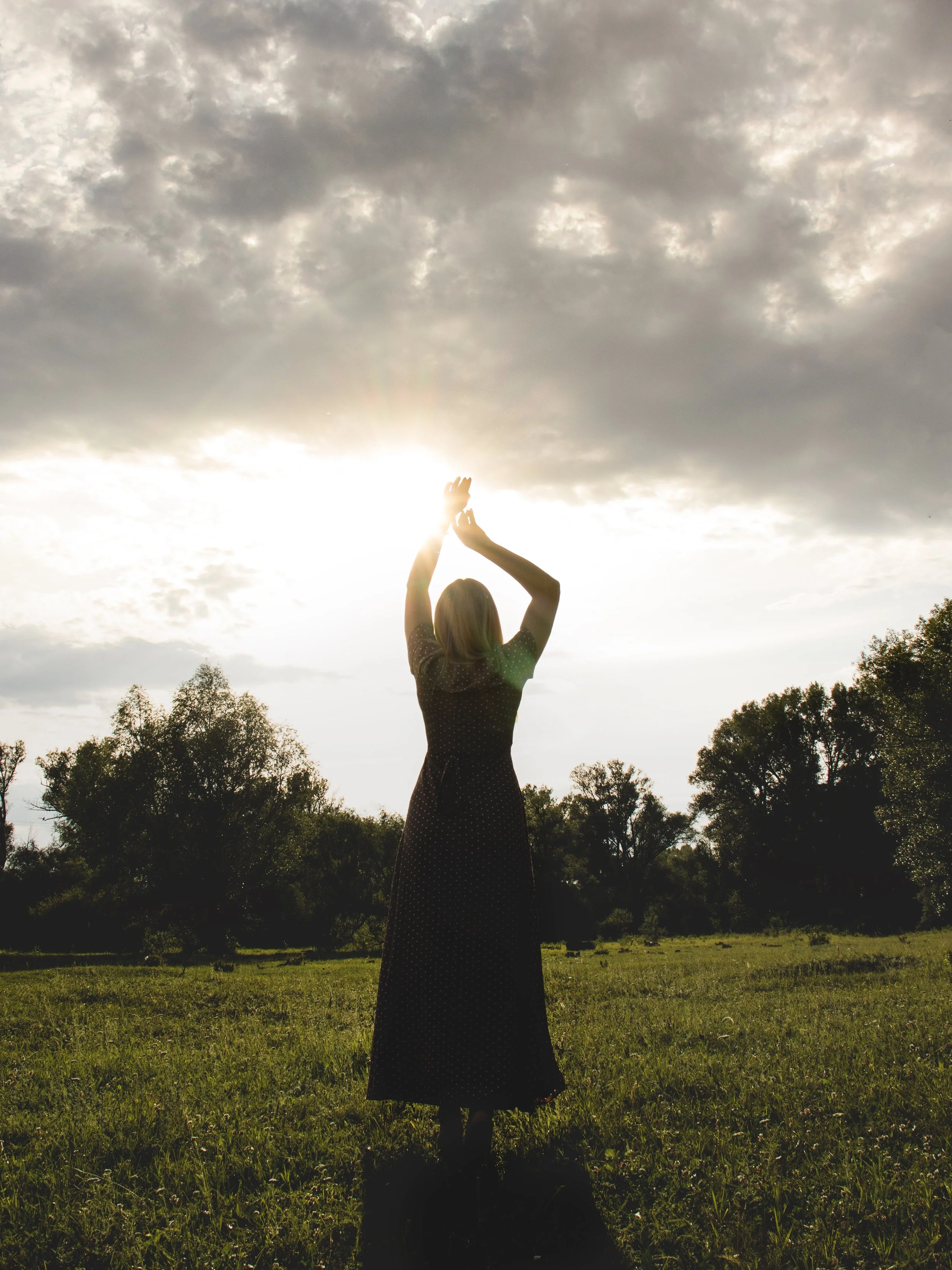 silhouette-of-a-woman-in-a-dress-against-the-sunse-2025-01-10-12-40-26-utc.jpg