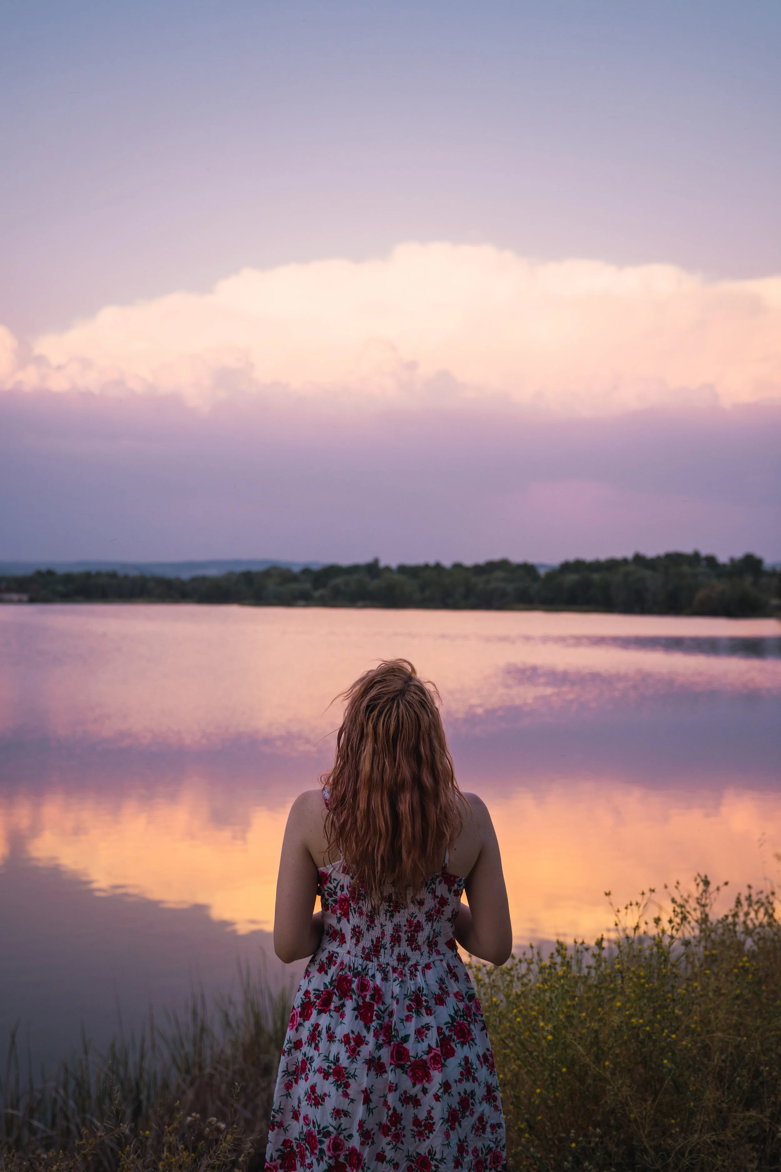 beautiful-woman-in-dress-on-lake-shore-in-sunset-2023-11-27-04-50-03-utc.jpg