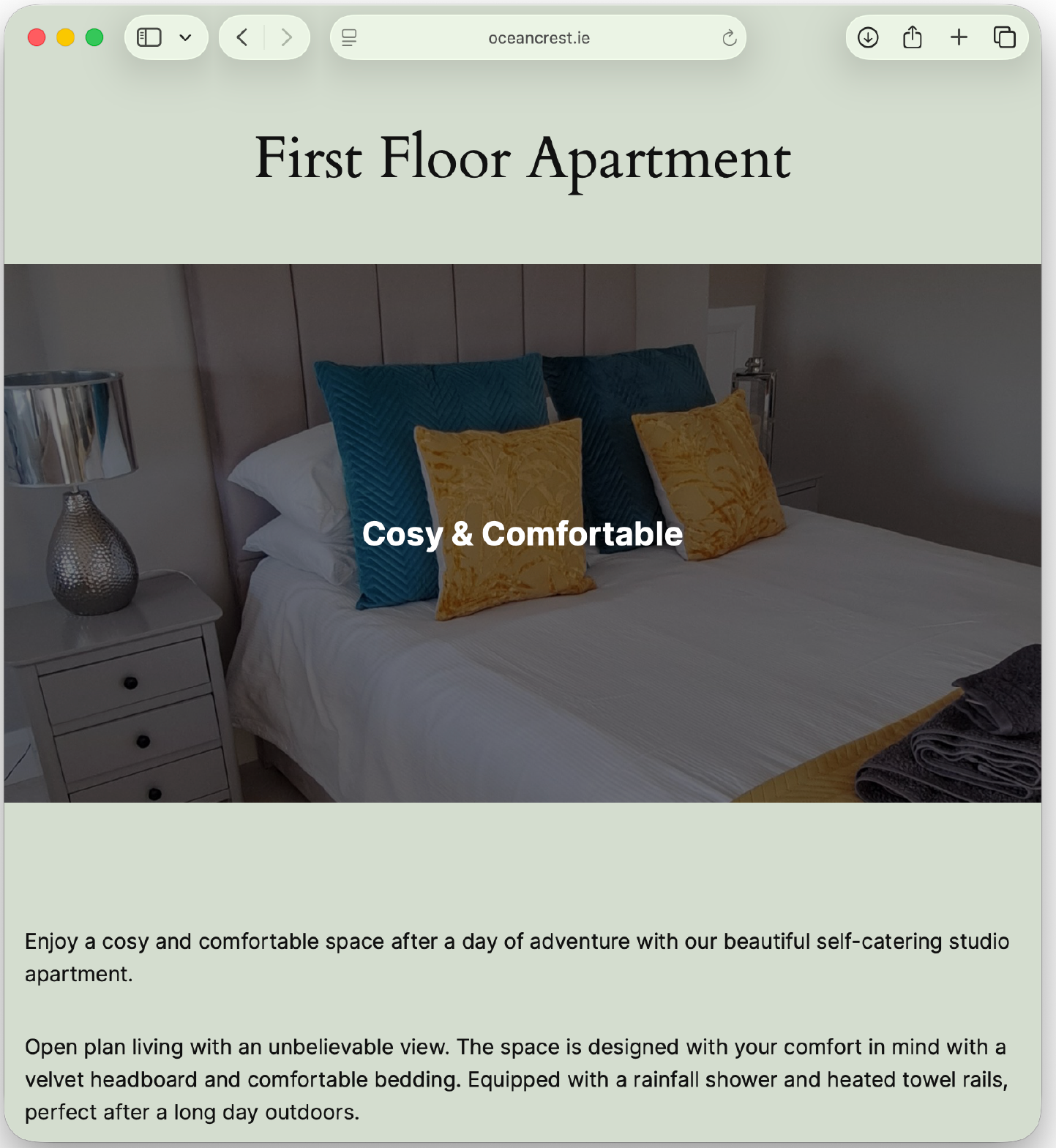 Photo of a cozy bedroom with a bed, decorative pillows, and a bedside table with a lamp.